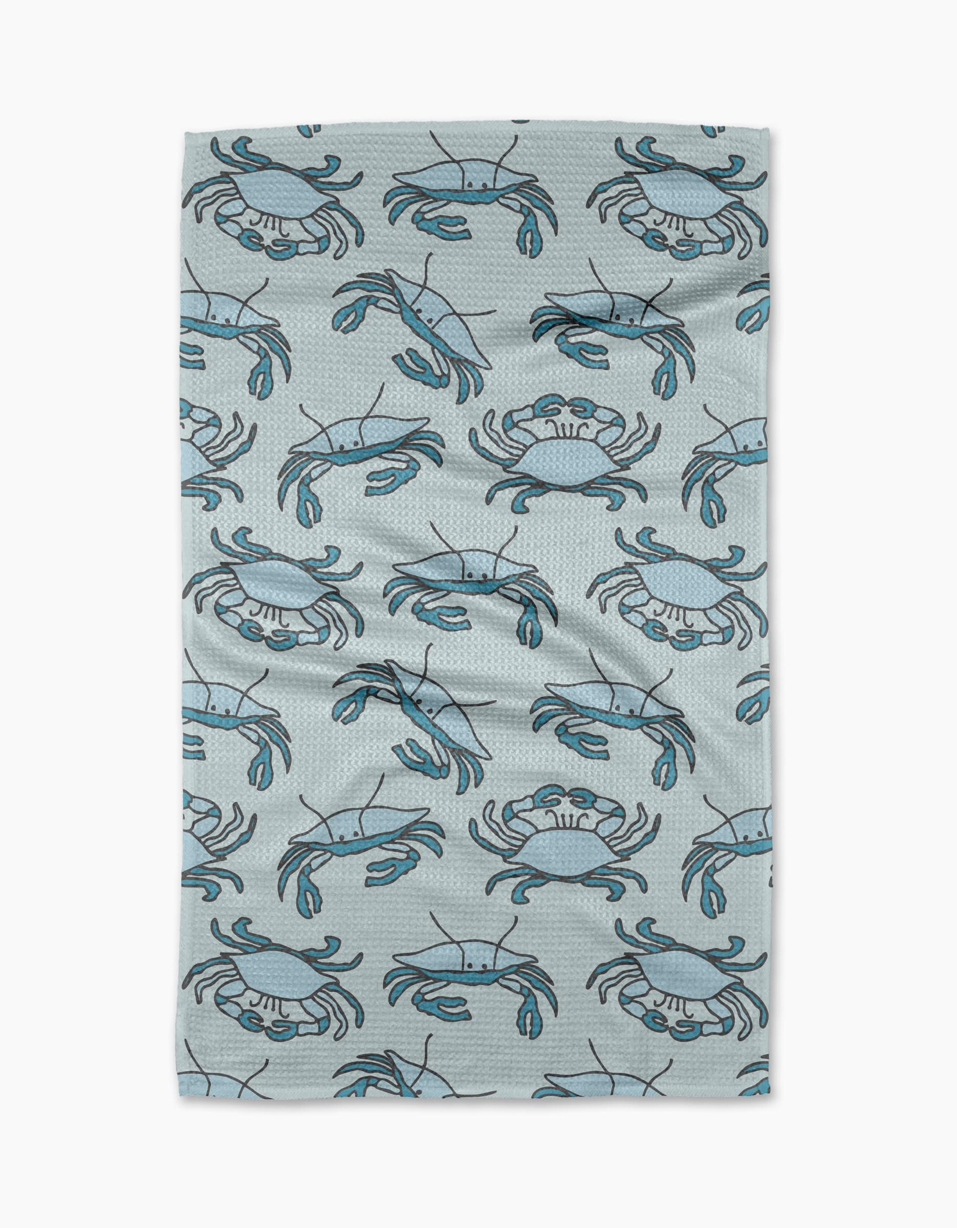 The Mindfulnice Coastal Crew is a textured, light gray recycled kitchen towel with a simple cartoon blue crab pattern. Ultra-absorbent and slightly wrinkled, it’s shown on a white background.