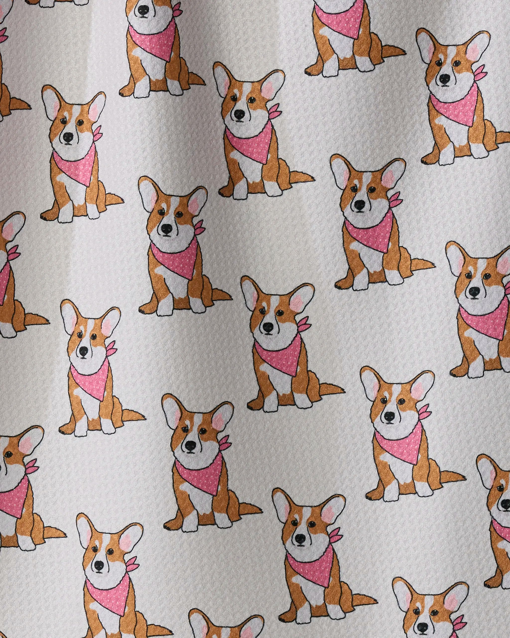 A cheerful pattern of cartoon corgi dogs sporting pink bandanas stands out against a soft, textured background. Designed in a simple and playful style with each corgi facing forward, the Geometry Corgi Pals ultra-absorbent towel is both charming and practical—making it an ideal addition to any kitchen.