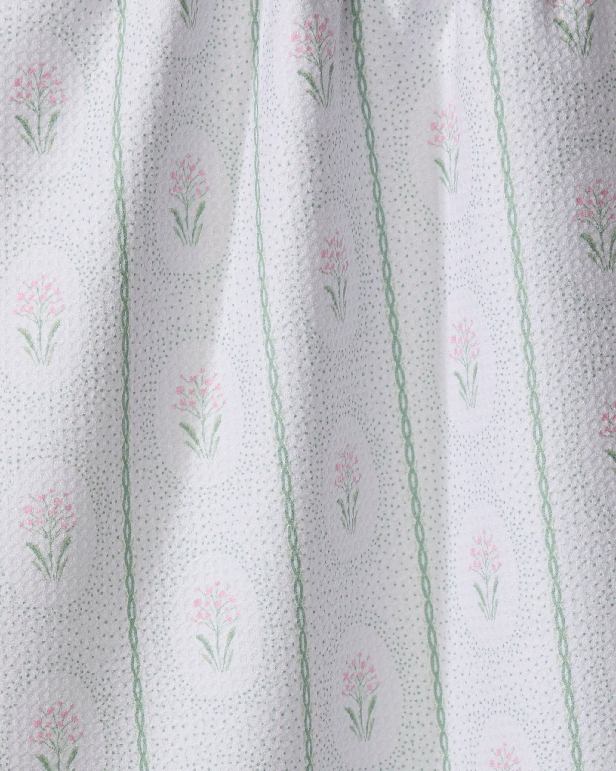 The Cottage Dainty Spotted towel by Hufton Studio is crafted from white textured fabric with light green vertical lines and ovals filled with delicate pink and green florals, adding soft, vintage charm and ultra-absorbency.