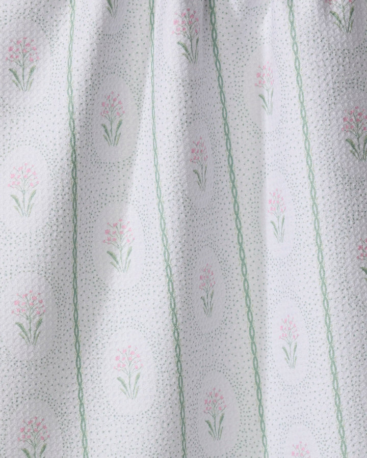 The Cottage Dainty Spotted towel by Hufton Studio is crafted from white textured fabric with light green vertical lines and ovals filled with delicate pink and green florals, adding soft, vintage charm and ultra-absorbency.
