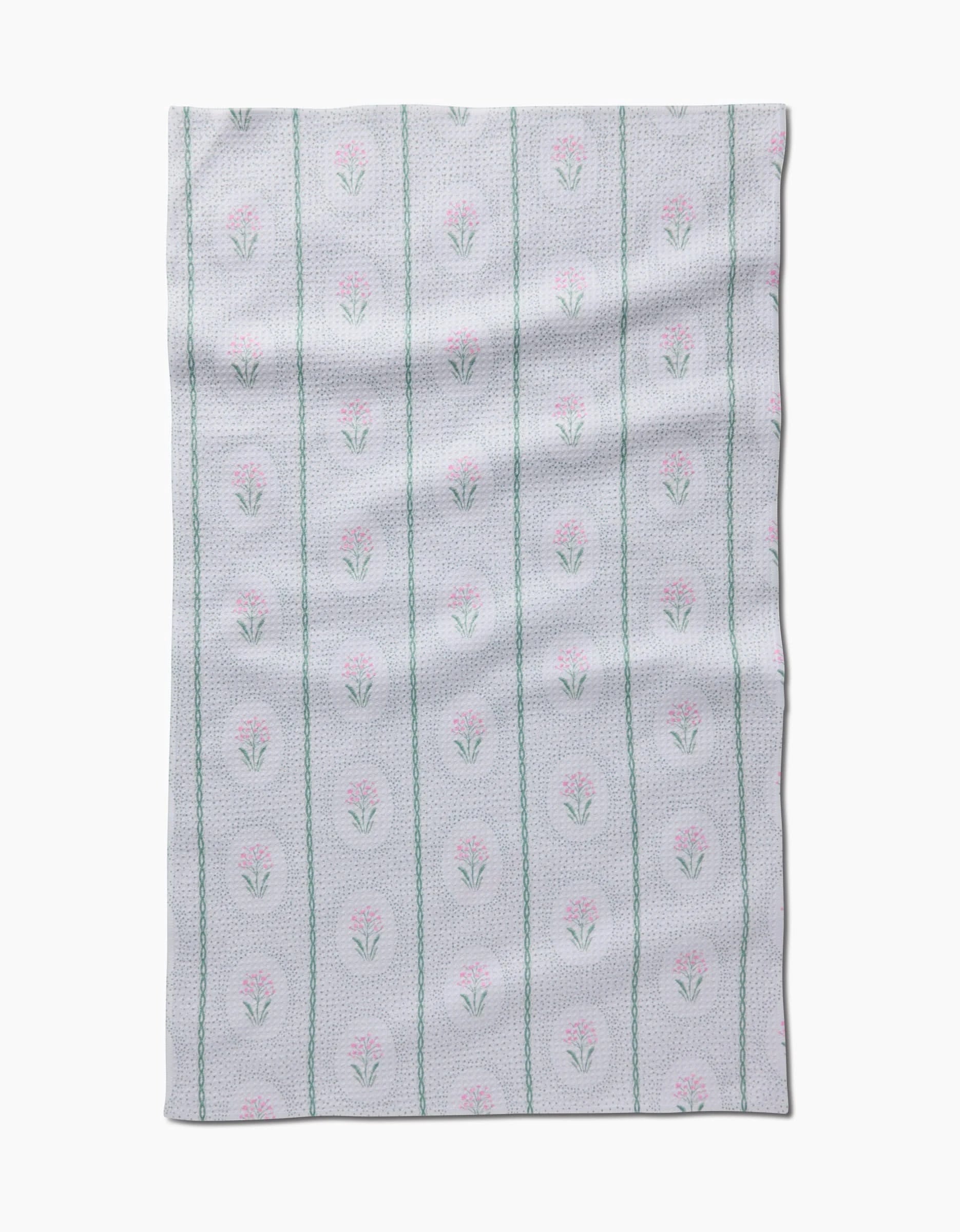 The Cottage Dainty Spotted Kitchen Tea Towel by Hufton Studio is a soft, light gray towel made of ultra-absorbent Geoweave fabric featuring rows of pink flowers with green stems and vertical green lines.