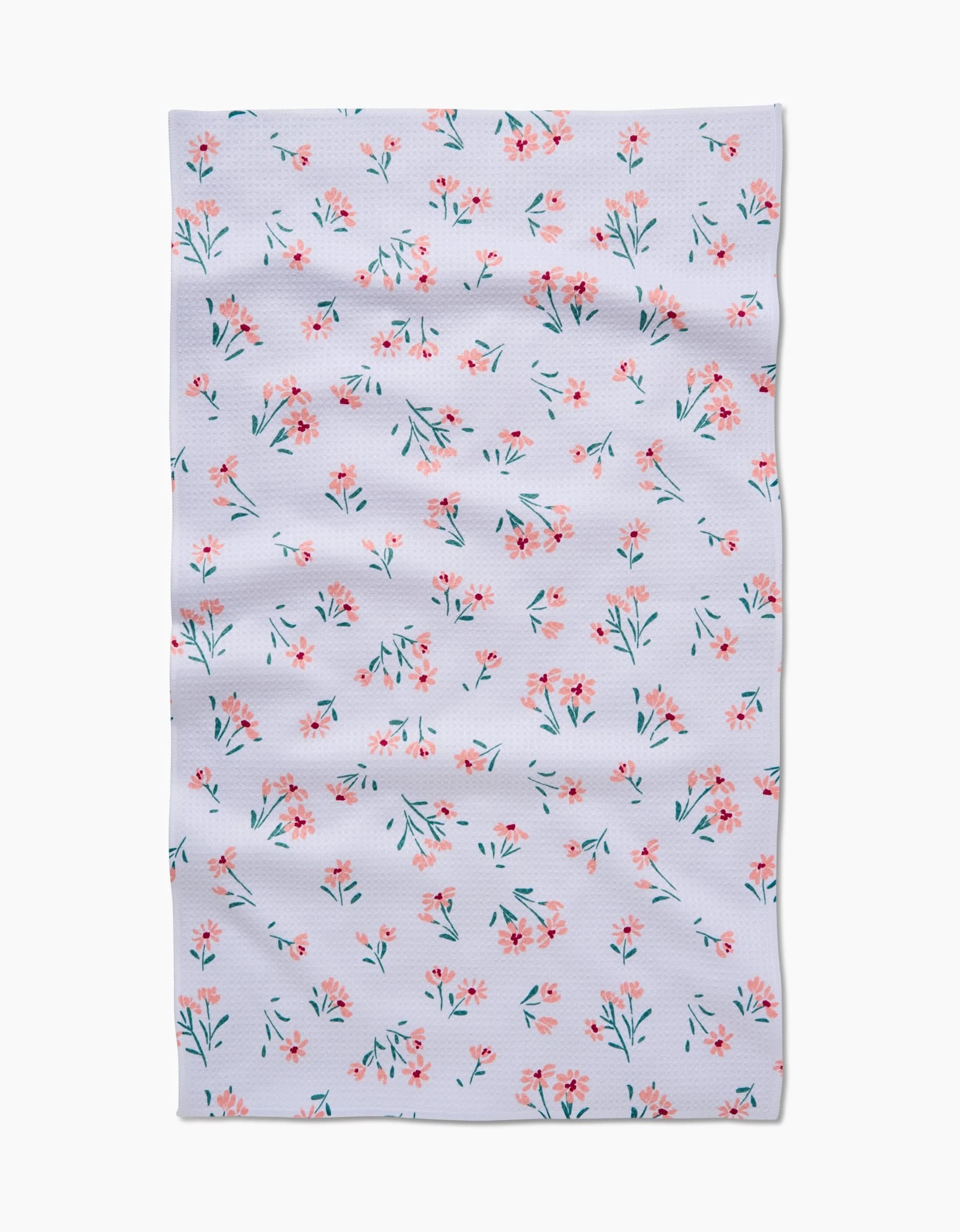 The Cottage Garden tea towel by Hufton Studio features a rectangular white design with scattered pink and red flowers and green leaves. Made from soft Geoweave fabric, it offers enhanced absorbency for everyday kitchen use.
