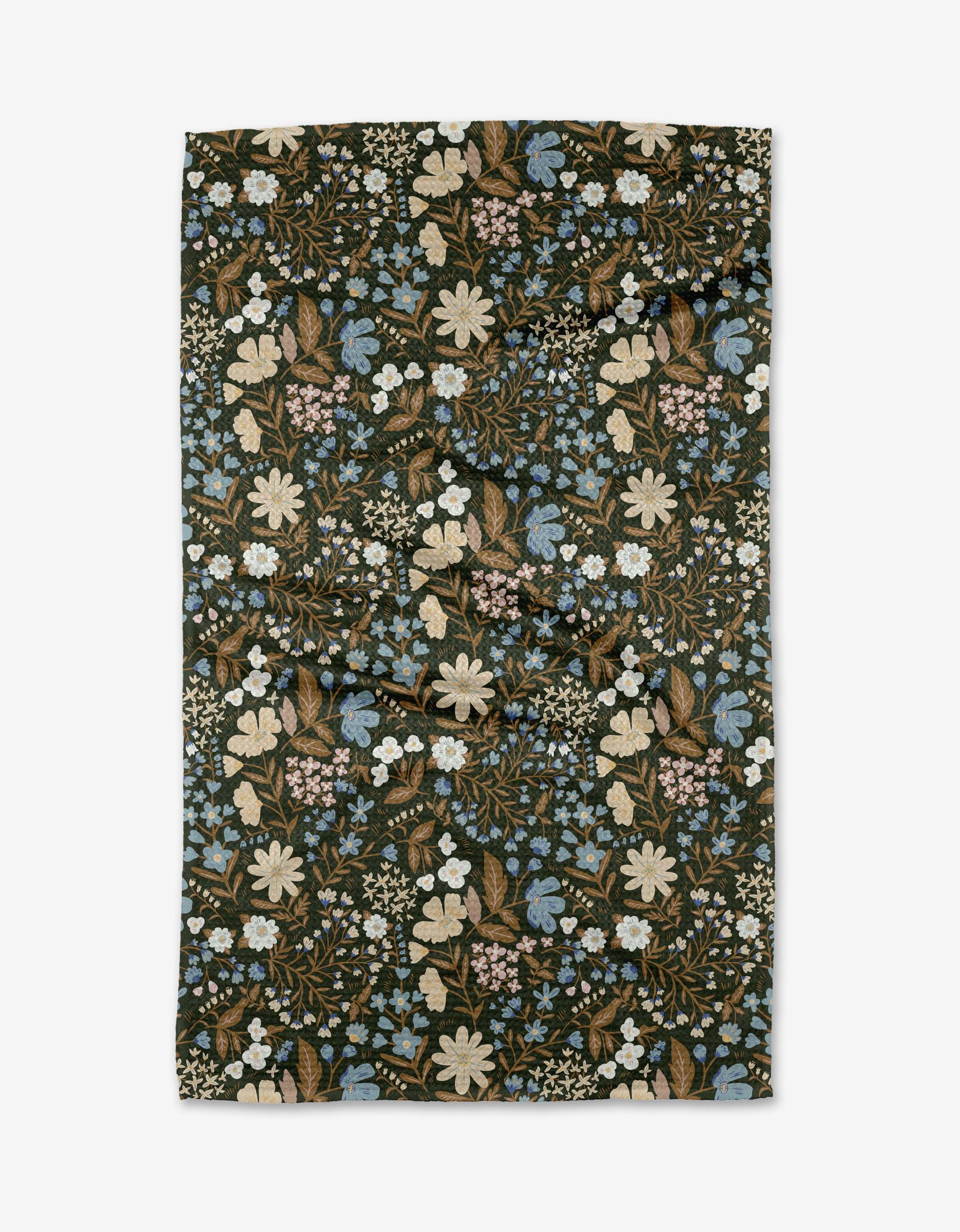 The Danelys Sidron Cottage Meadow Sepia tea towel features a dense floral pattern in cream, light blue, and pale pink on a dark background. Made from Geoweave™ fabric, it appears slightly wrinkled on a white surface.