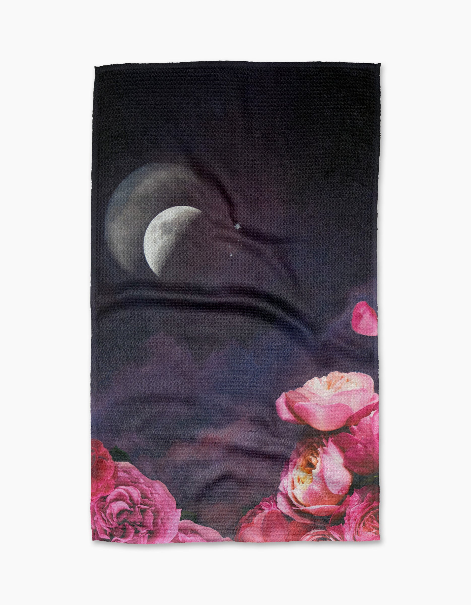 Counterglow by Stefanie Bales is a dark tea towel featuring a crescent moon, two stars, and blooming pink and peach roses. Made from ultra-absorbent recycled materials for a beautiful and sustainable addition to your kitchen.