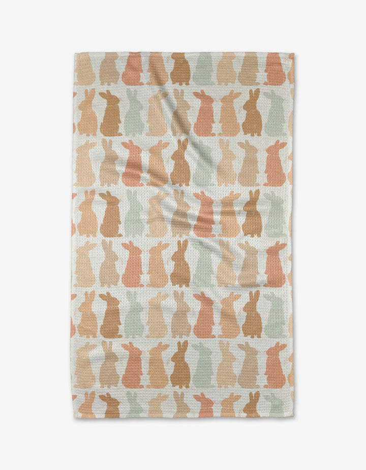 The Cute Easter Bunny tea towel by Hufton Studio is a rectangular, eco-friendly kitchen towel with rows of pastel bunny silhouettes on a light background—perfect as an absorbent and decorative dish towel.