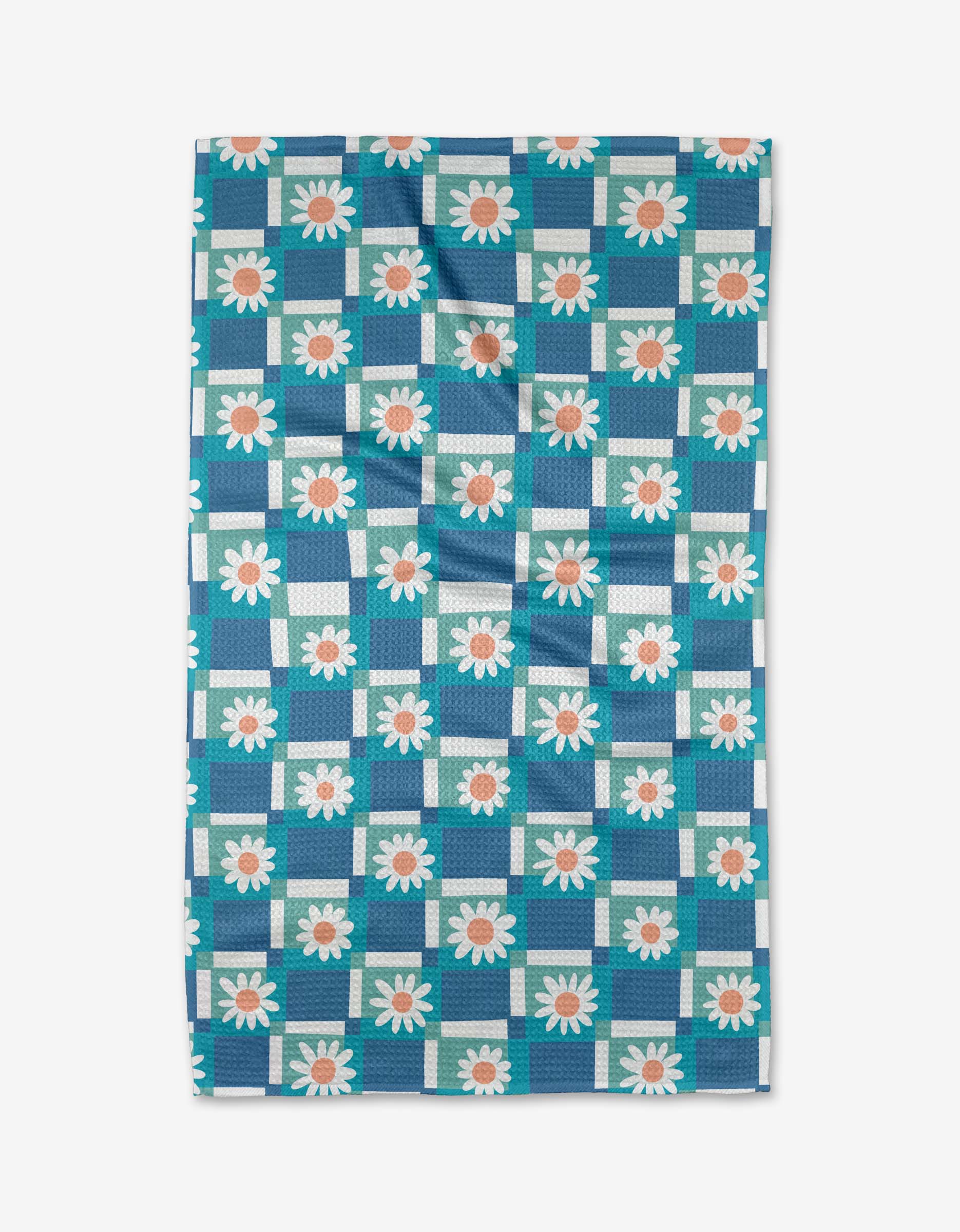 The Daisy Daisy tea towel by Rachel Parker features a blue and white checkered pattern with daisies—white petals and orange centers—in each square. Made from recycled materials, the towel is shown flat with slight wrinkles.