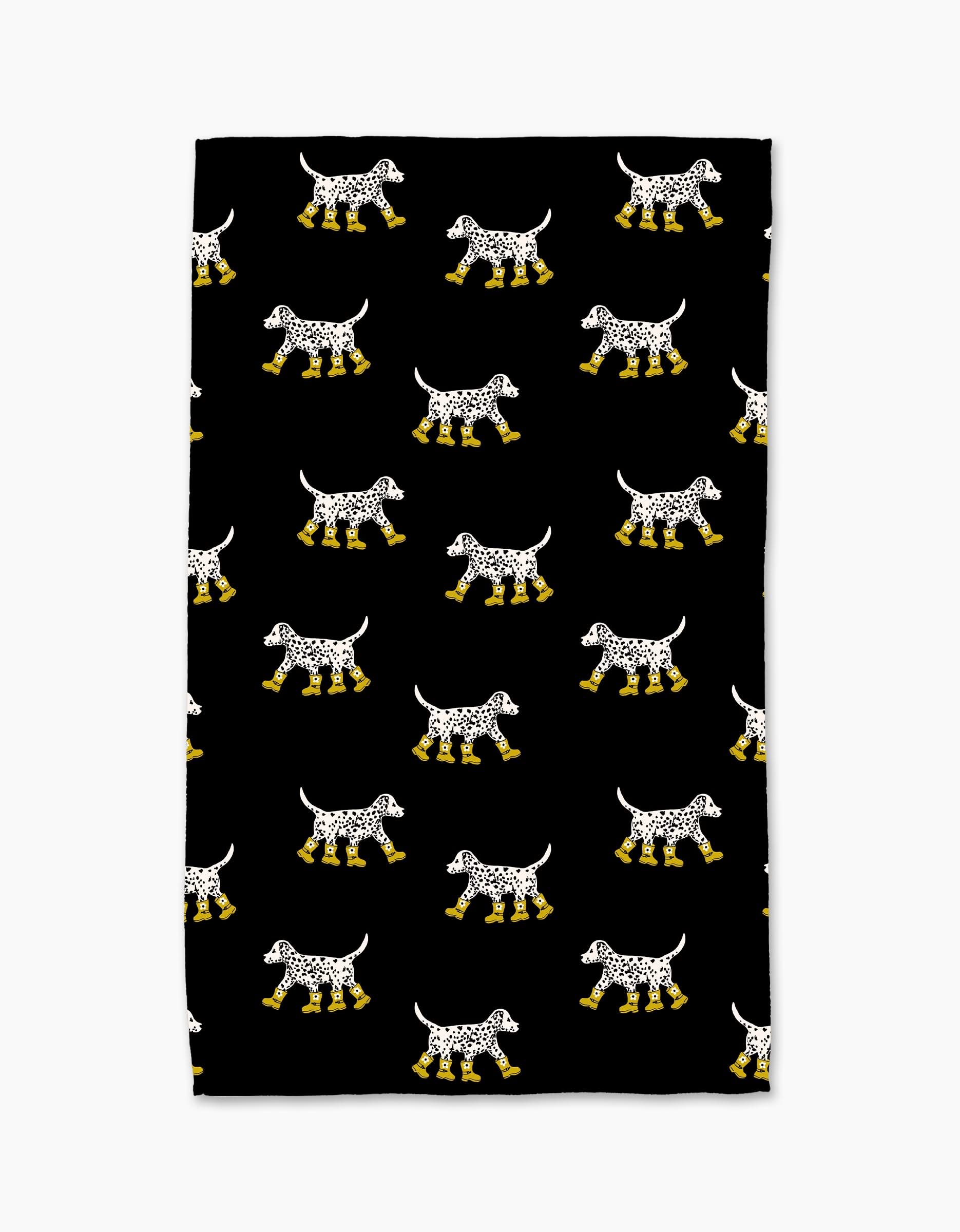 Geometry’s Dalmatian In Boots Black Tea Towel features a playful pattern of spotted Dalmatian dogs in yellow boots on a black background, made from recycled materials for an eco-friendly touch.