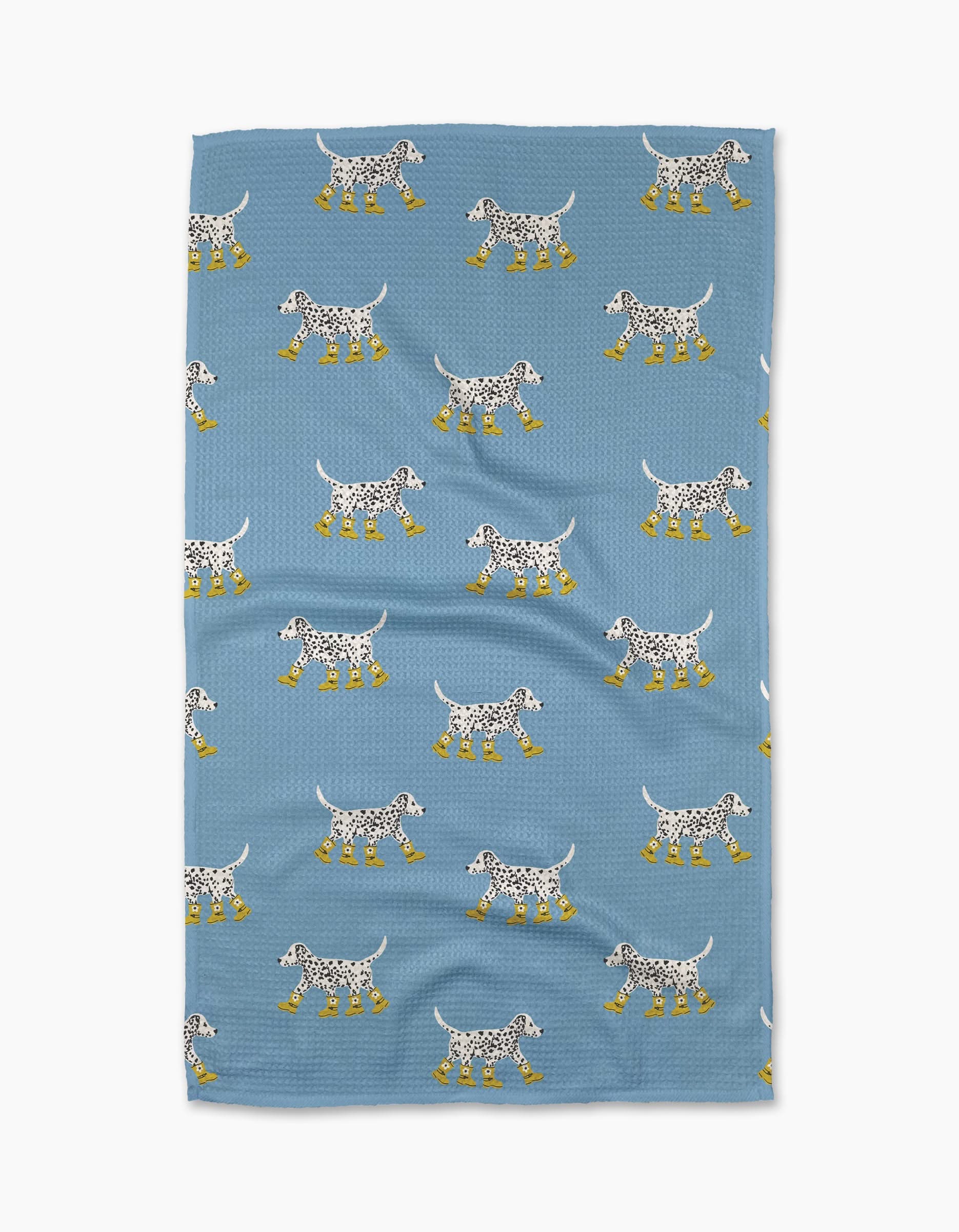 The Dalmatian In Boots Blue tea towel by Geometry features a charming Dalmatian dog pattern with yellow boots, made from soft Geoweave fabric and recycled materials.