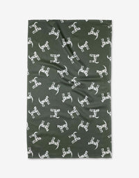 Dalmation Dogs by Coit Creative is a dark green Geoweave fabric with a playful white Dalmatian dog pattern. Made from recycled materials, the fabric is shown laid flat with slight wrinkles.