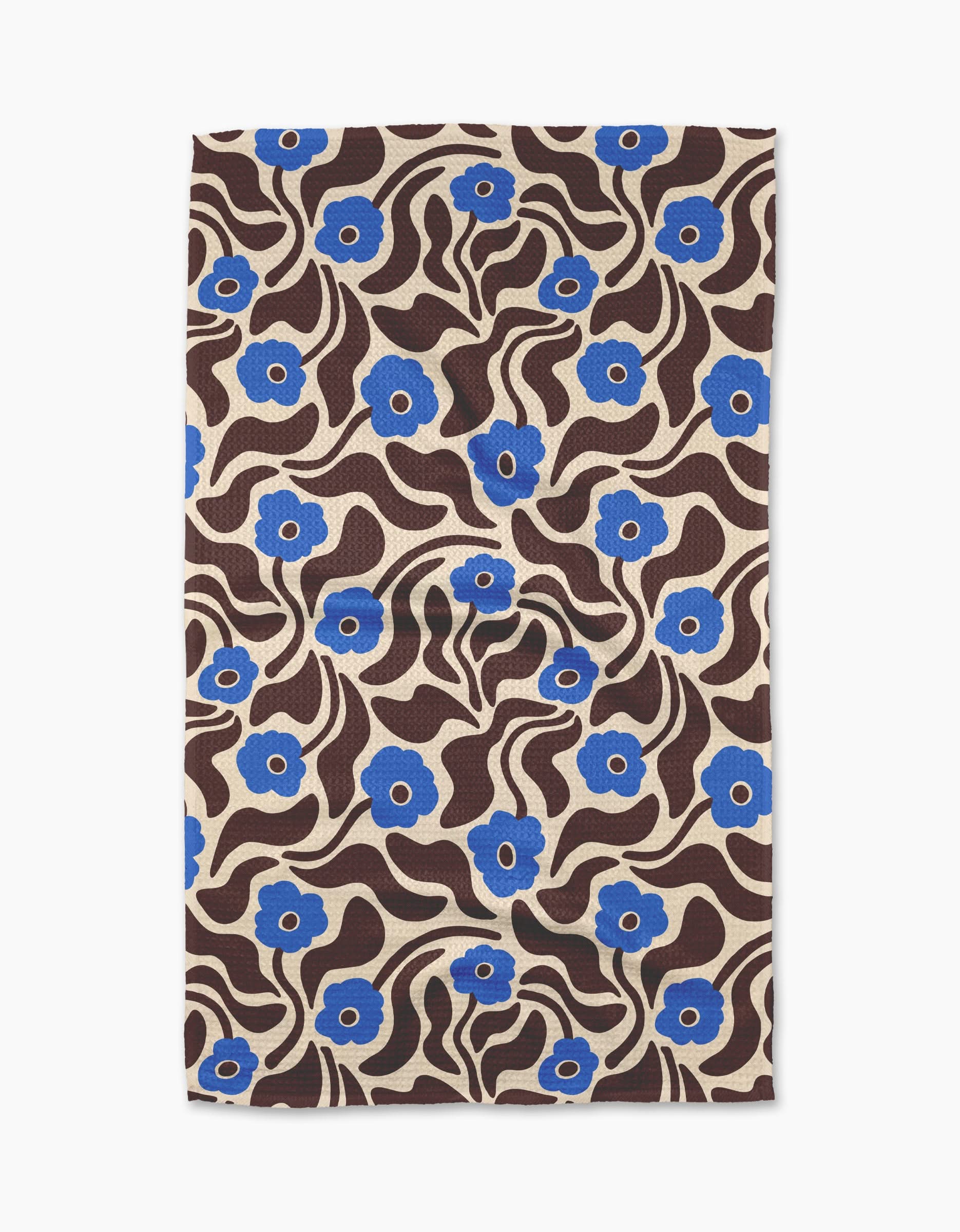 The Gerdadzy Dancing Blooms tea towel features a beige background with blue flowers, wavy brown lines, and leaves in a bold, retro style. Made from recycled materials.