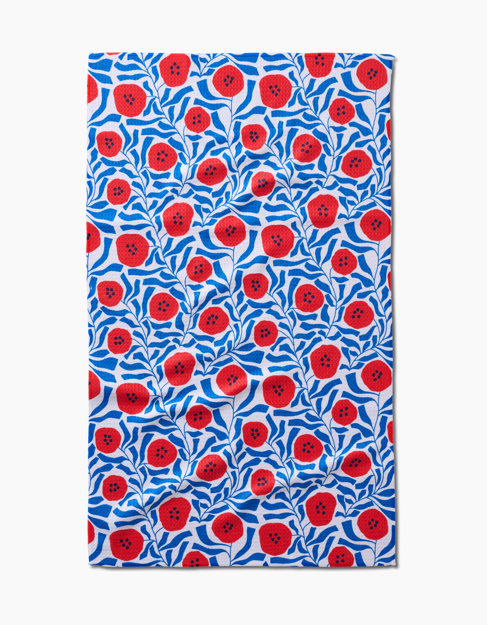 The Happy Hemera Dancing Poppies cloth is made from ultra-absorbent Geoweave fabric and showcases a vibrant red poppy and blue leaf pattern on white, bringing bold charm to any space.