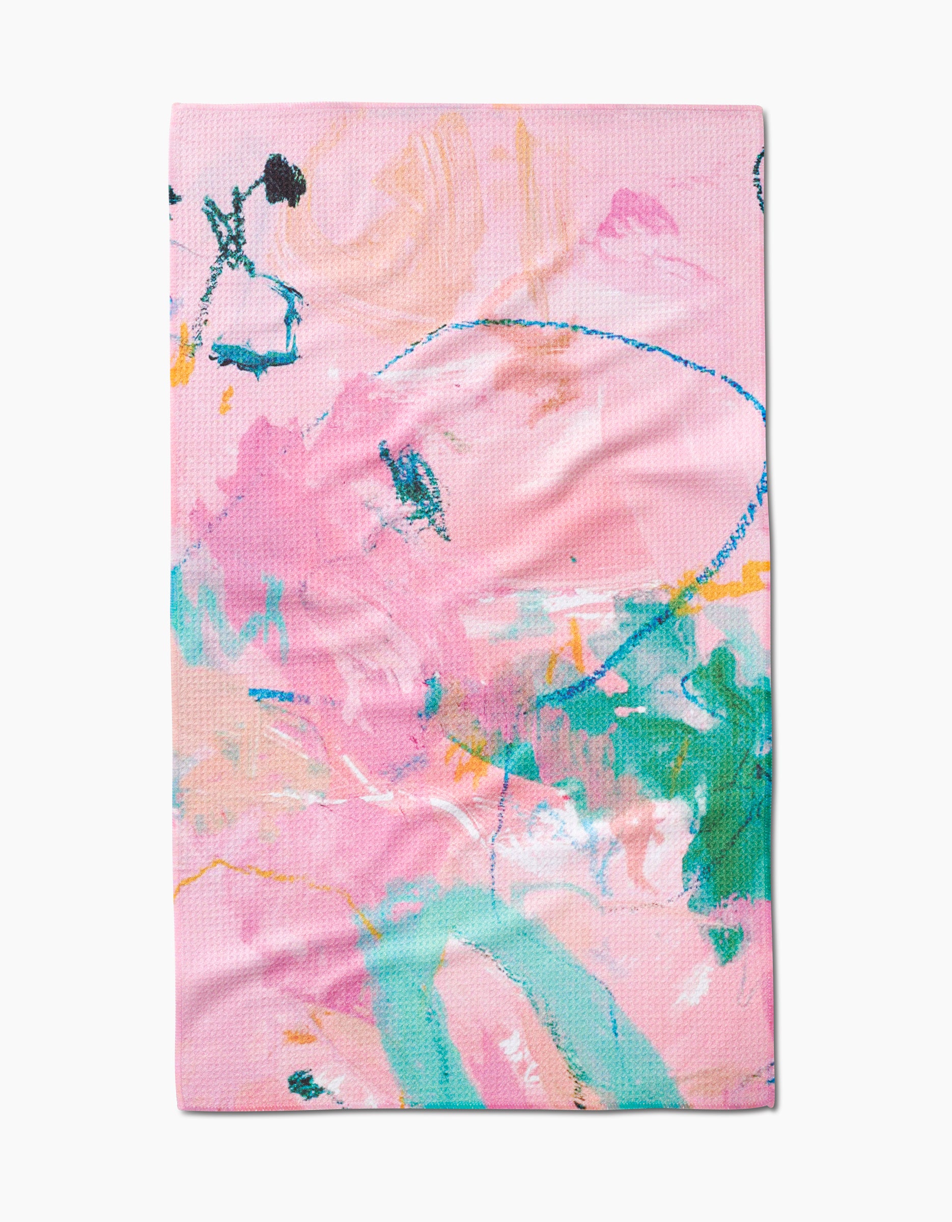 The Daughter tea towel by Sarah Holden features an abstract, colorful design with pink, green, blue, orange, and yellow brushstrokes and scribbles on a light pink background. Made from recycled materials.