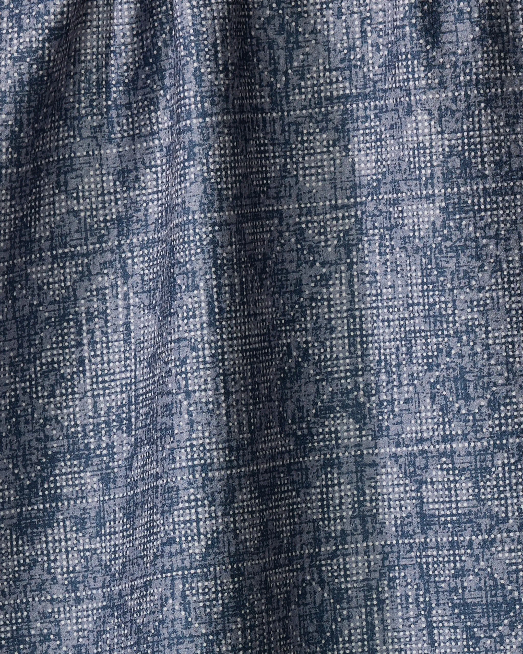 Close-up of Becki Owens' Debra Blue tea towel fabric, featuring a blue and white woven grid pattern with textured details and subtle shading variations.