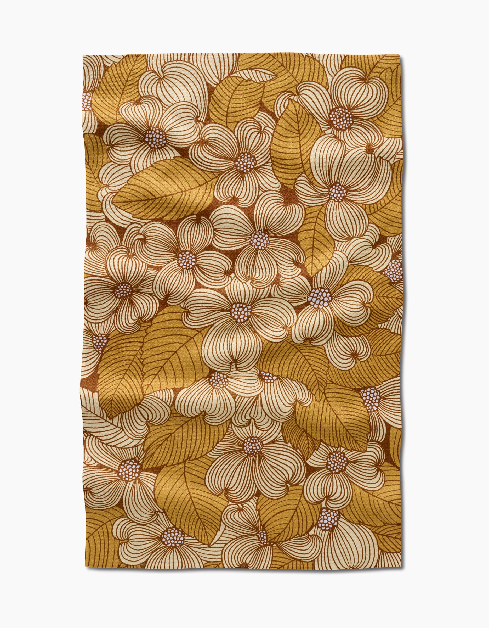 The Dogwood tea towel by Katie OShea is rectangular and made from recycled materials, featuring an intricate floral and leaf pattern in mustard yellow, brown, and cream for a dense, decorative look.