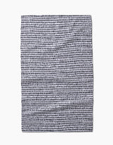 Geometrys Dot Dot Dot Fresh Linen is a square recycled kitchen towel featuring an irregular grid of small, uneven black dots on a white background. The slightly wrinkled fabric is shown laid flat on a white surface.