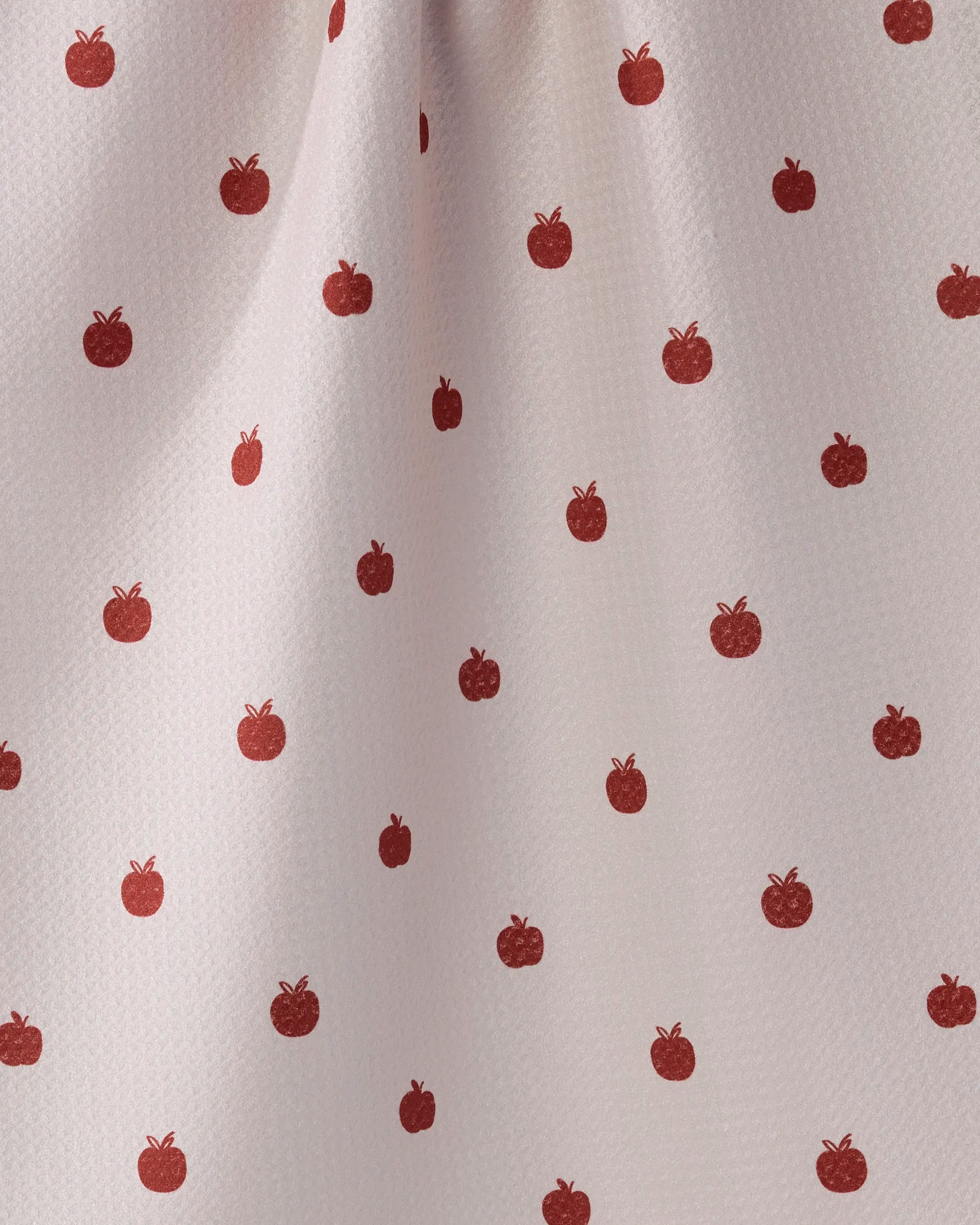The Dotty Apple by Geometry is a white kitchen tea towel featuring small, evenly spaced red apple prints. Ultra-absorbent with soft folds and a subtle textured surface, it’s the perfect stylish addition to your kitchen.