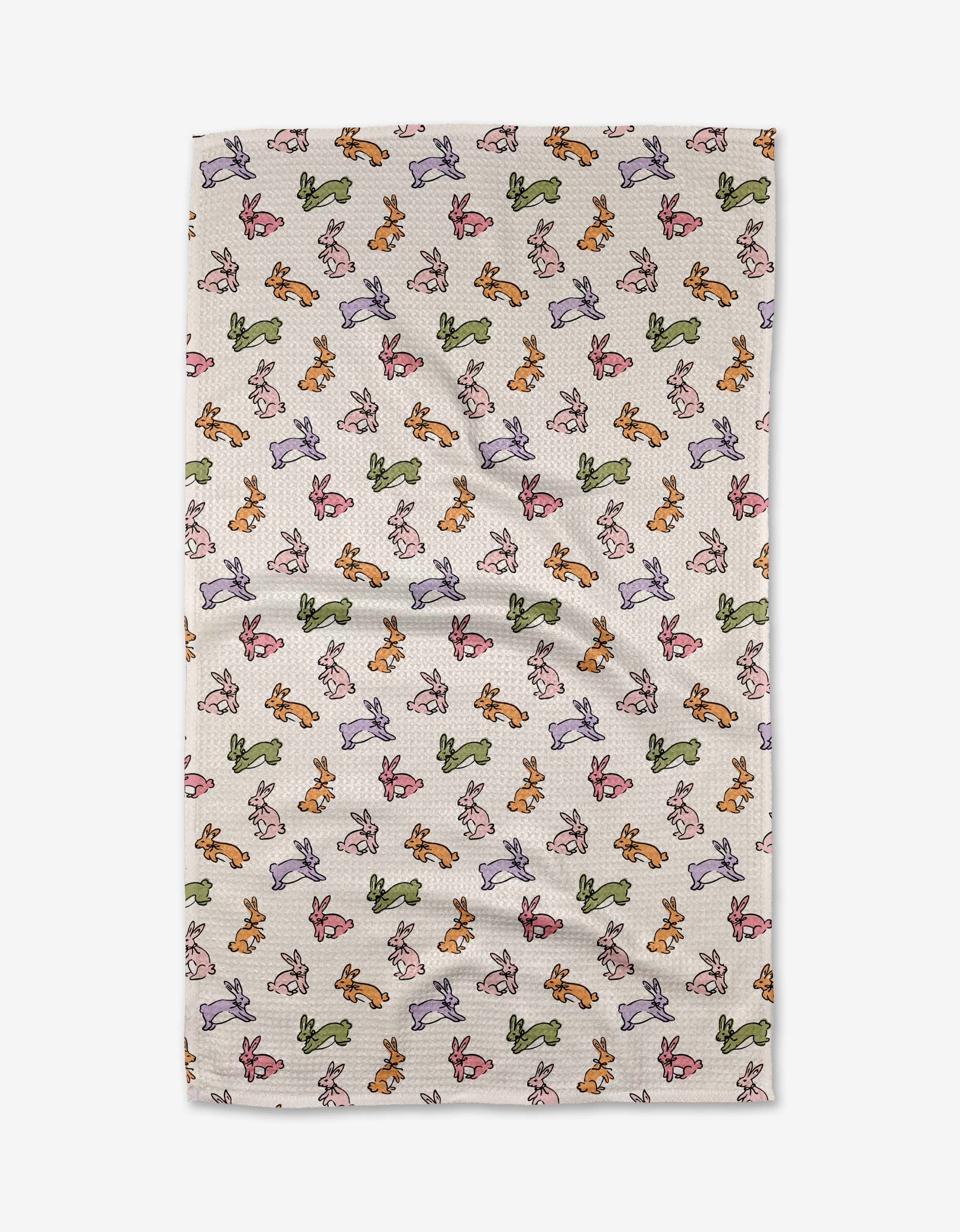 The Kayla Ann Easter Bunny tea towel features rows of green, orange, pink, and purple bunnies and is made from recycled materials for an eco-friendly touch.