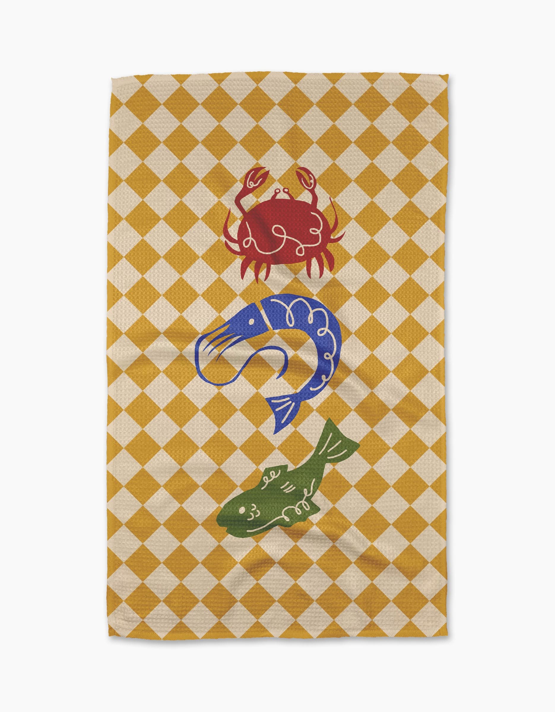 The El Mar Dos tea towel by Geometry features a yellow and white checkered design with a red crab, blue shrimp, and green fish stacked in the center. Made from ultra-absorbent Geoweave fabric for both style and functionality.
