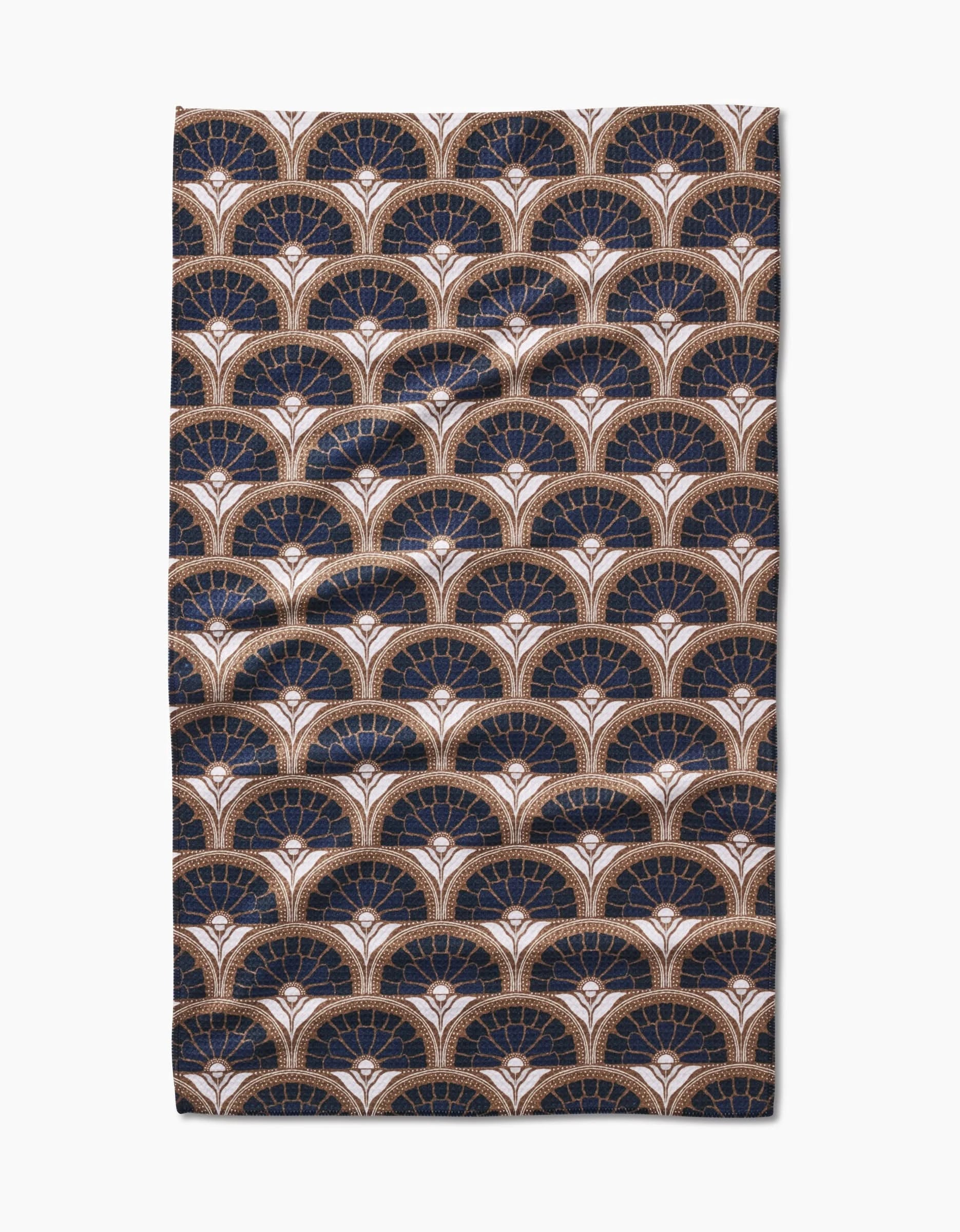 The Eliza tea towel by Amy MacCready features a repeating Art Deco fan pattern in navy, gold, and white on ultra-absorbent fabric—scalloped fans add style to any modern kitchen.