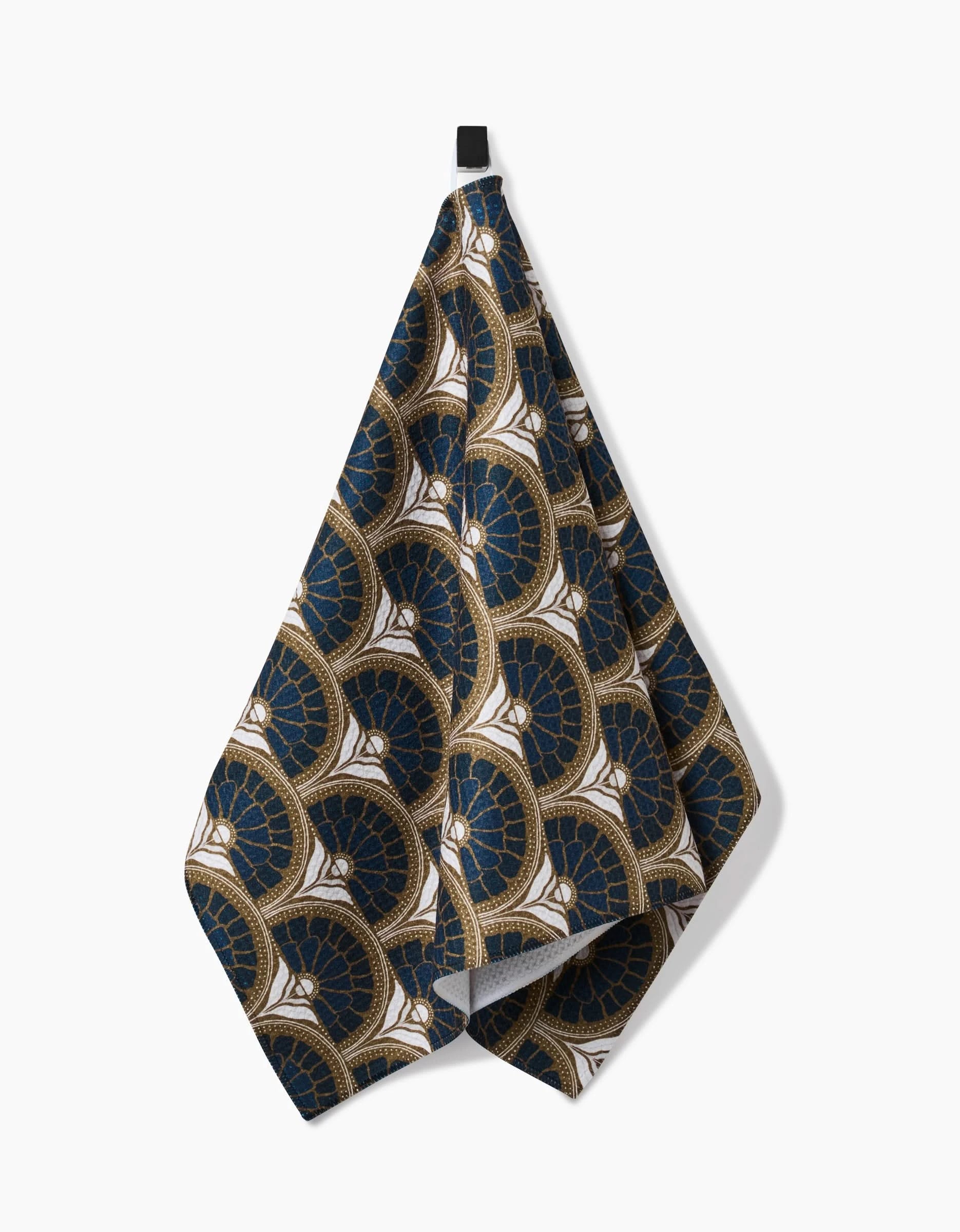 The Eliza tea towel by Amy MacCready features an art deco fan pattern in dark blue, gold, and white. Crafted from ultra-absorbent recycled materials, it is displayed against a plain white background.