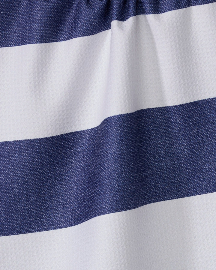 Close-up of the Geometry Everband kitchen towel, featuring wide horizontal navy blue and white stripes. The textured, wavy surface with gentle folds highlights its sustainable, recycled material construction.