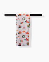 The Fall Favorites tea towel by Ceyda Alasar features vibrant Thanksgiving motifs—pumpkins, pies, turkeys, wreaths, and autumn leaves—on white. Quick-drying, it brings festive charm to your kitchen décor.