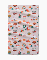 Add seasonal charm to your kitchen with Ceyda Alasar’s “Fall Favorites” tea towel—a beige recycled towel adorned with pumpkins, pies, leaves, mushrooms, and cozy autumn designs. Its slight wrinkle adds character to your fall decor.