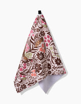 The Fall Fowl Tea Towel by Kayla Ann, made with Geoweave™ fabric and showcasing brown floral and bird patterns with pink and green accents, hangs from a black loop against a plain white background.