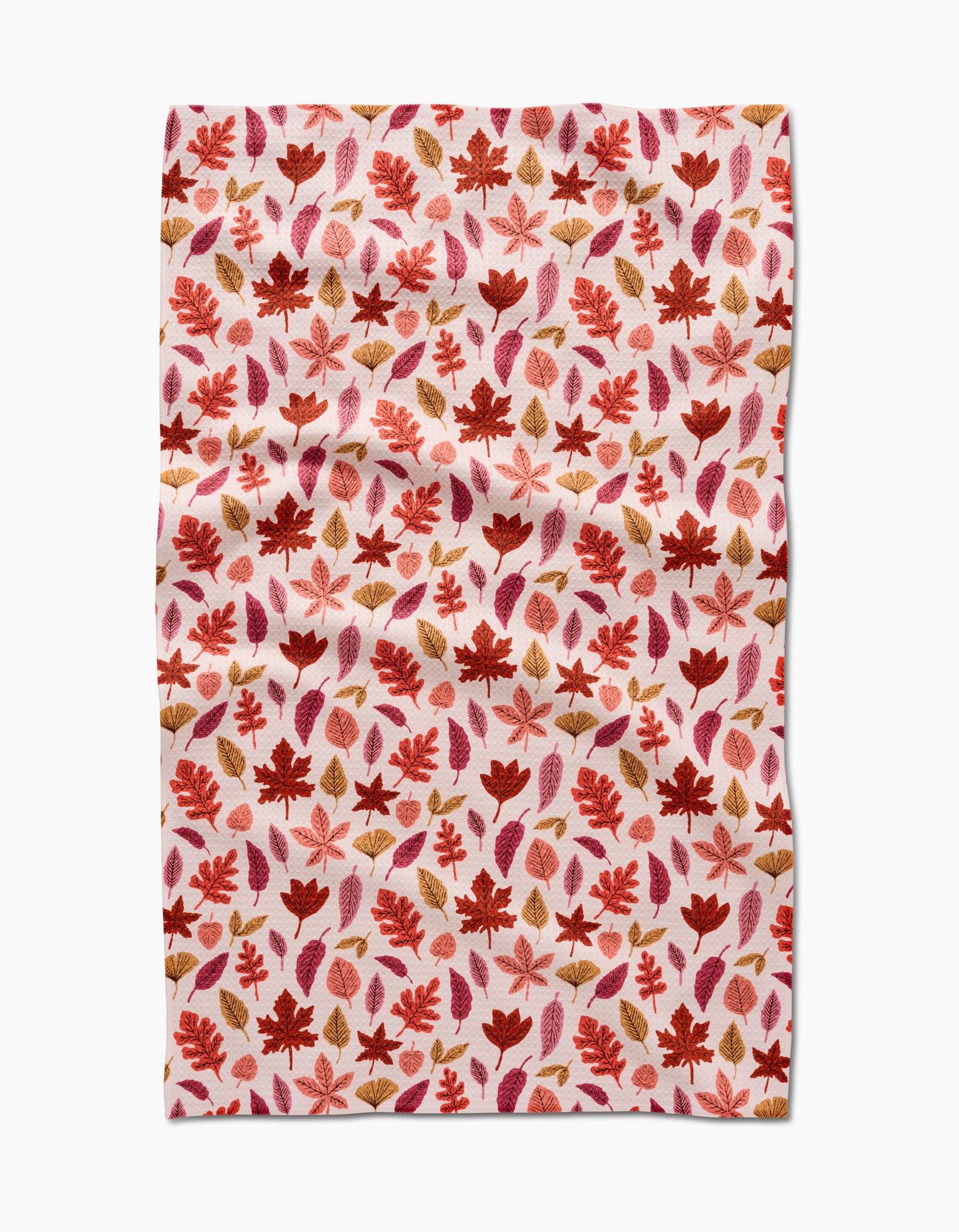 The Fall Leaves tea towel by Kayla Ann features a red, orange, and brown autumn leaf pattern on white. This absorbent, slightly wrinkled cloth is perfect for adding eco-friendly charm to your kitchen décor.