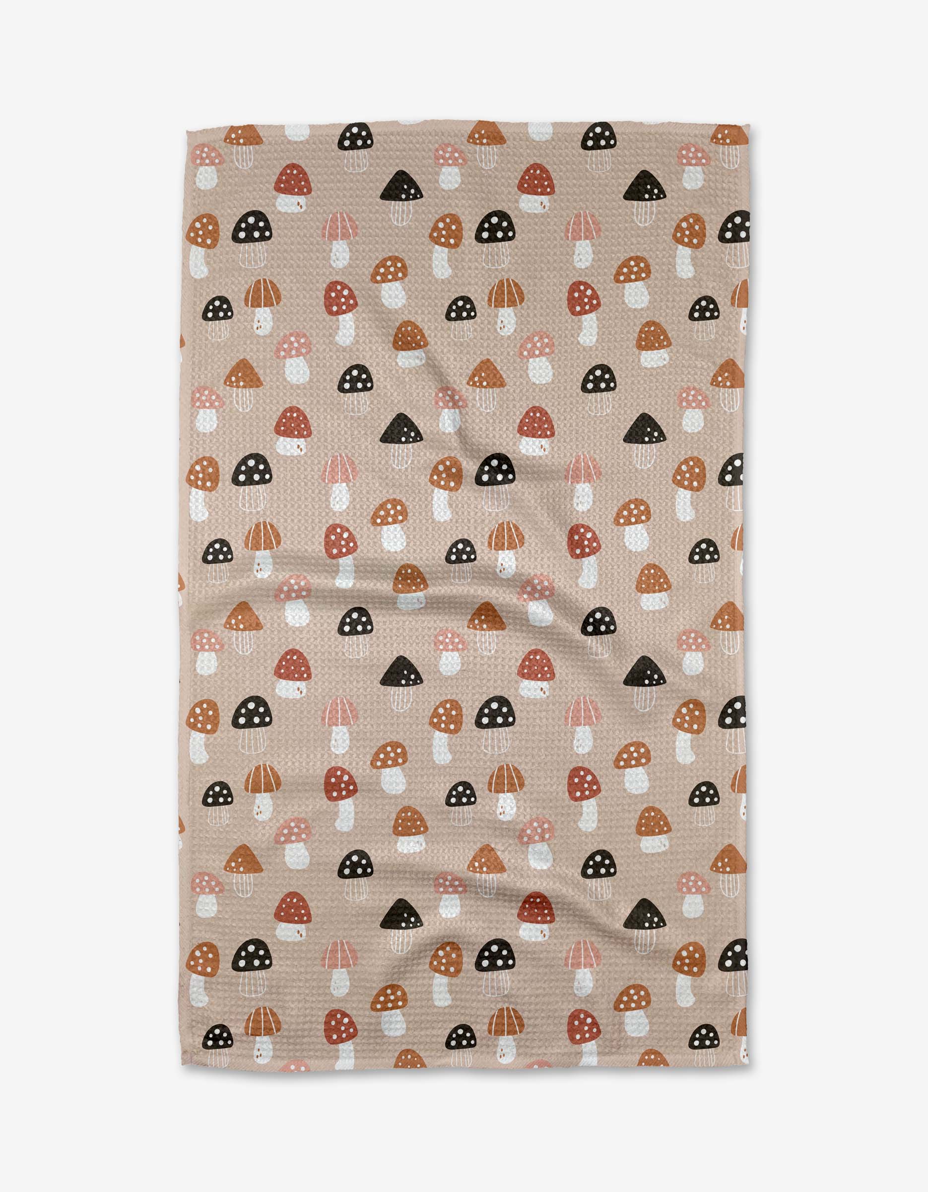 The Fall Mushroom Harvest tea towel by Marina Solodka is crafted from Geoweave™ fabric, featuring a beige textured base with brown, black, white, and orange mushroom patterns scattered evenly across the surface.