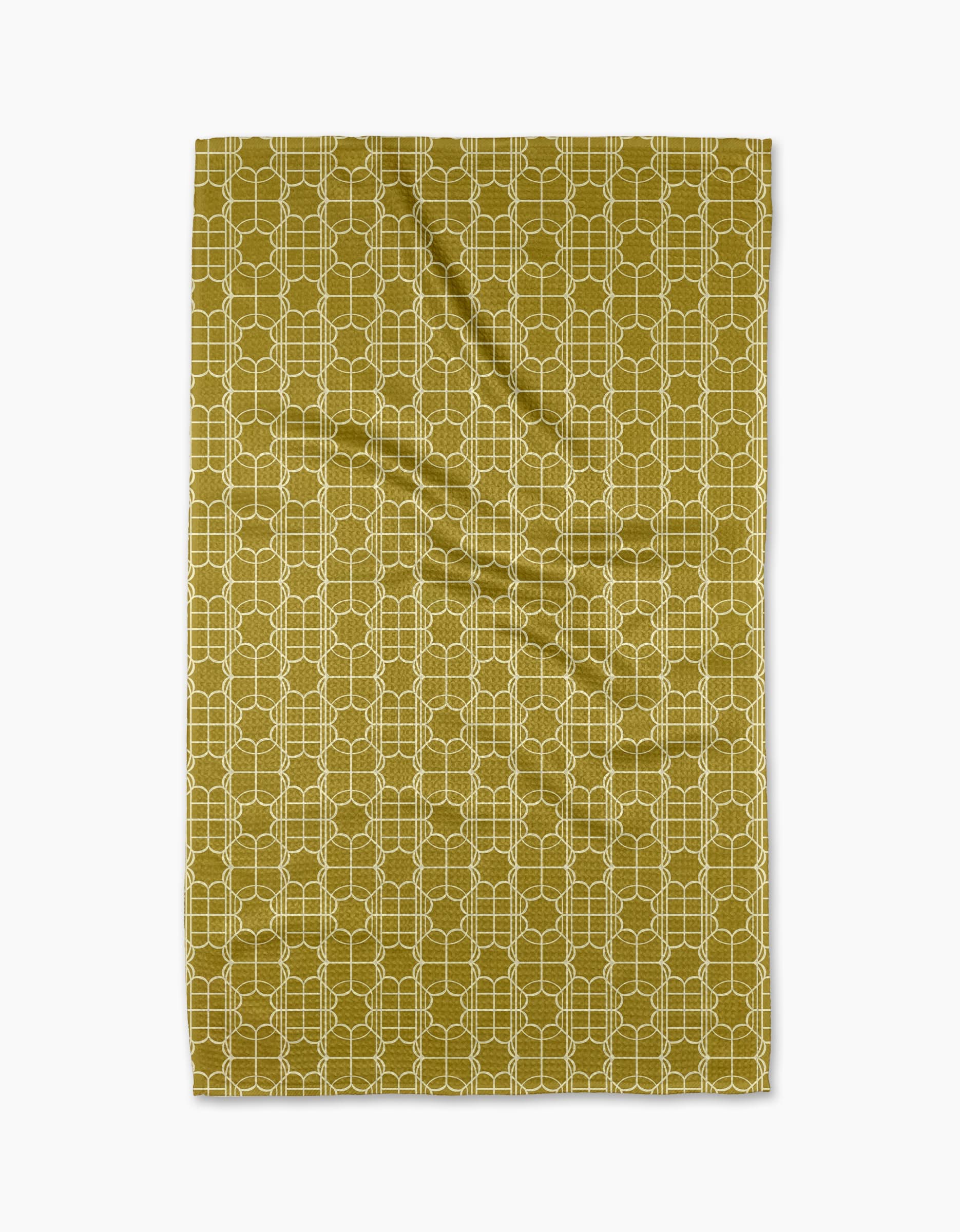 The Ferran tea towel by Geometry features a white geometric lattice on olive green Geoweave fabric, shown slightly wrinkled against a white background.