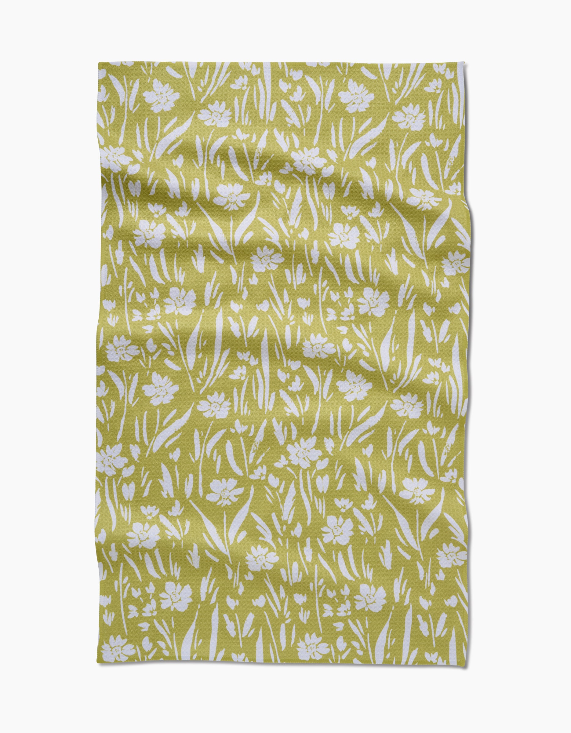 The Ashley Celena Field of Wildflowers Geoweave fabric features a yellow-green backdrop with white floral and grass designs. Ultra-absorbent and made from recycled materials, it offers eco-friendly style in every detail.