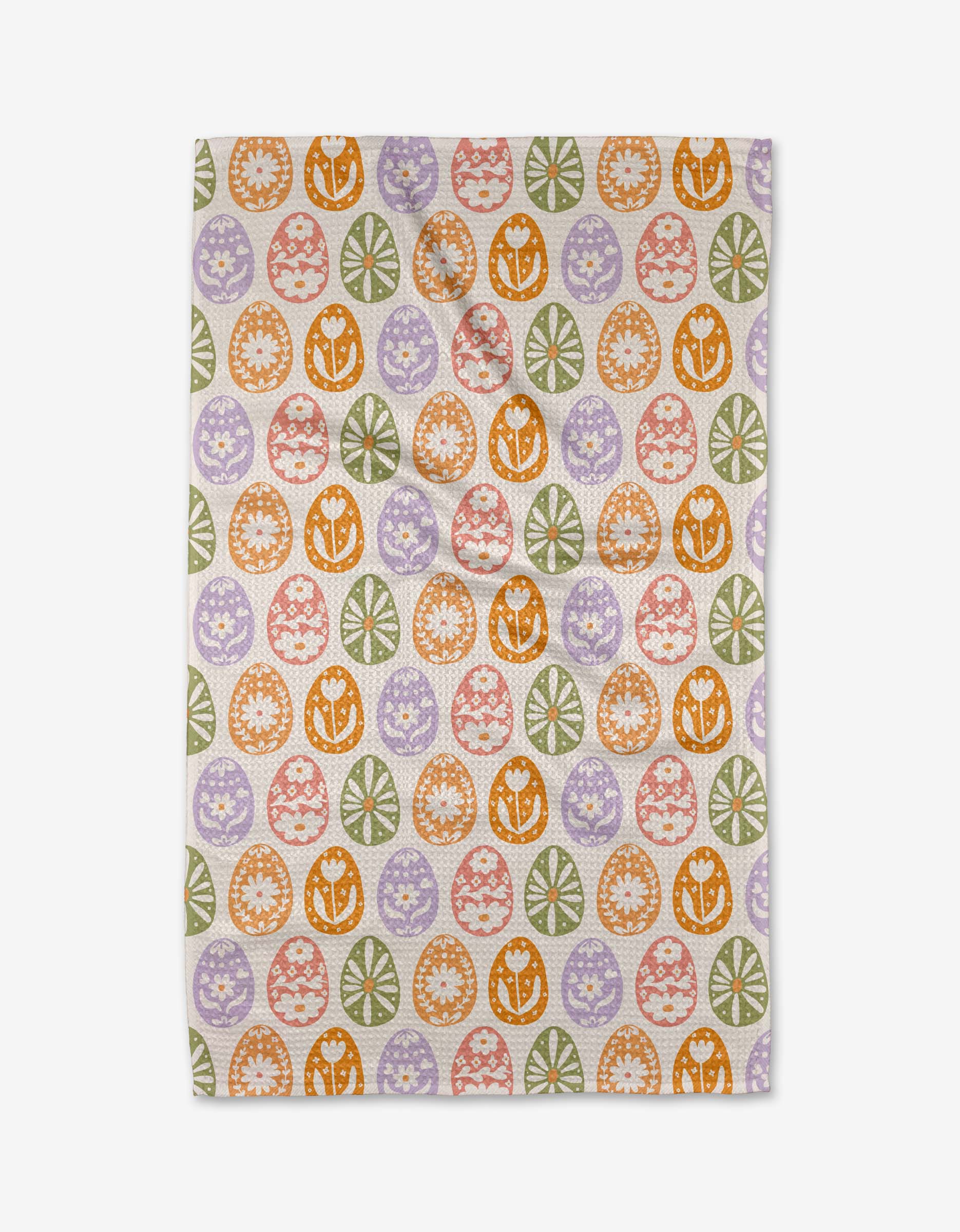 The Kayla Ann Floral Easter Egg tea towel is made from recycled materials and features a white background with a repeating pattern of orange, green, purple, and red decorated Easter eggs in intricate designs.