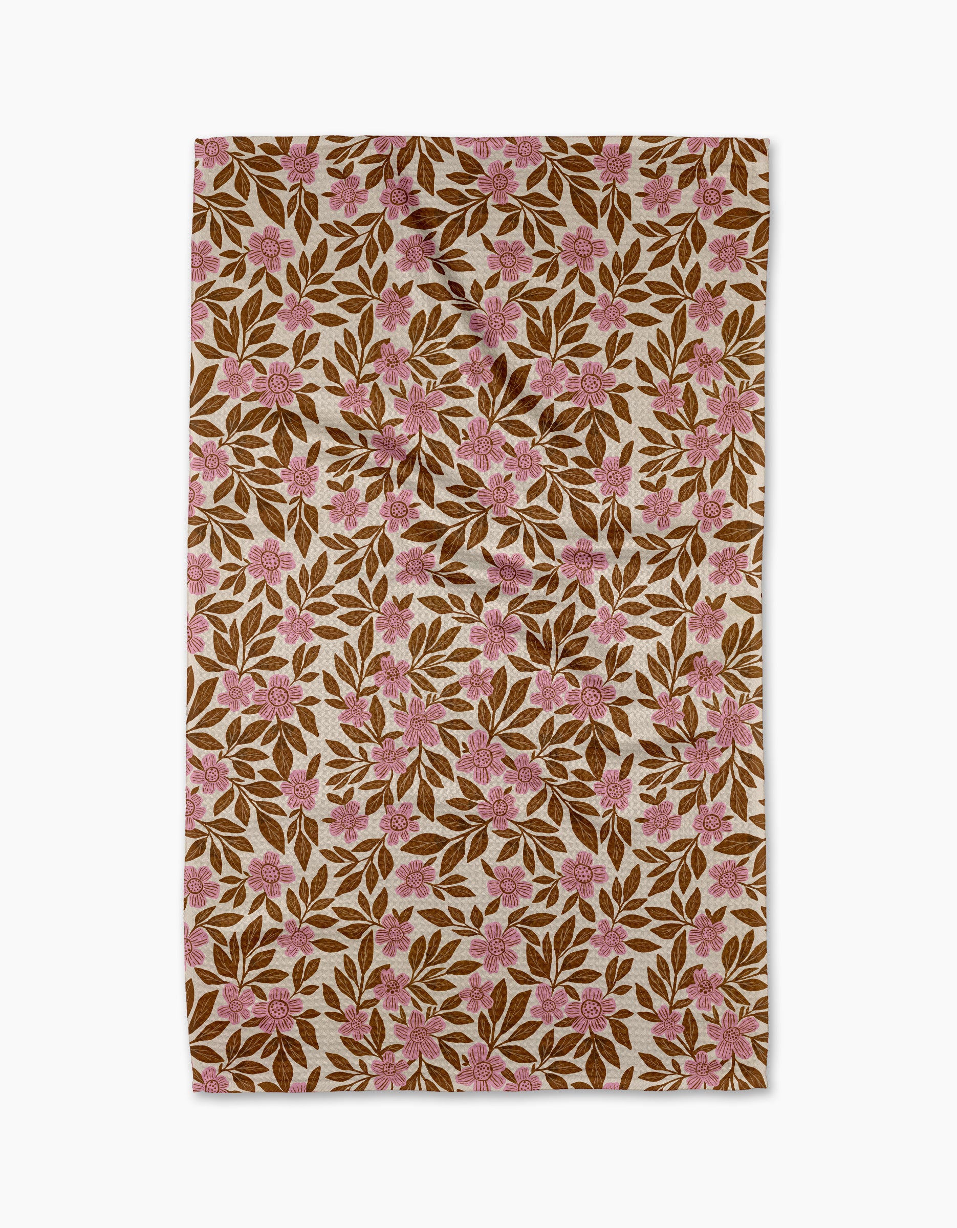 The Lisa Nelson "Floral Meadow" tea towel features pink flowers and brown leaves on an off-white background. Its ultra-absorbent design ensures style and practicality for your kitchen.