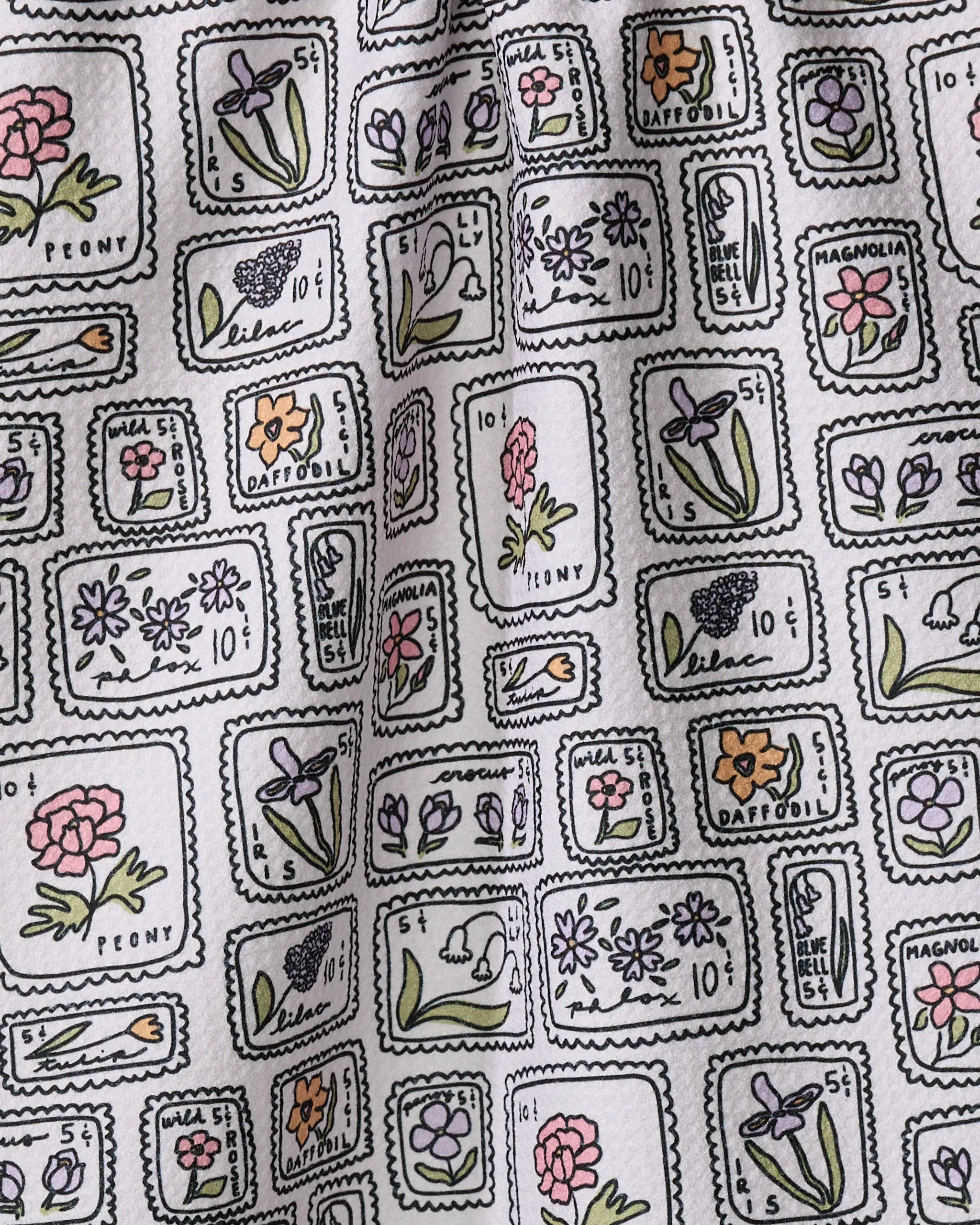 Kayla Ann’s Floral Postage Stamps kitchen towel showcases vintage-style stamp illustrations with hand-labeled flowers—peonies, daffodils, lilacs—and is crafted from recycled materials for eco-friendly charm.