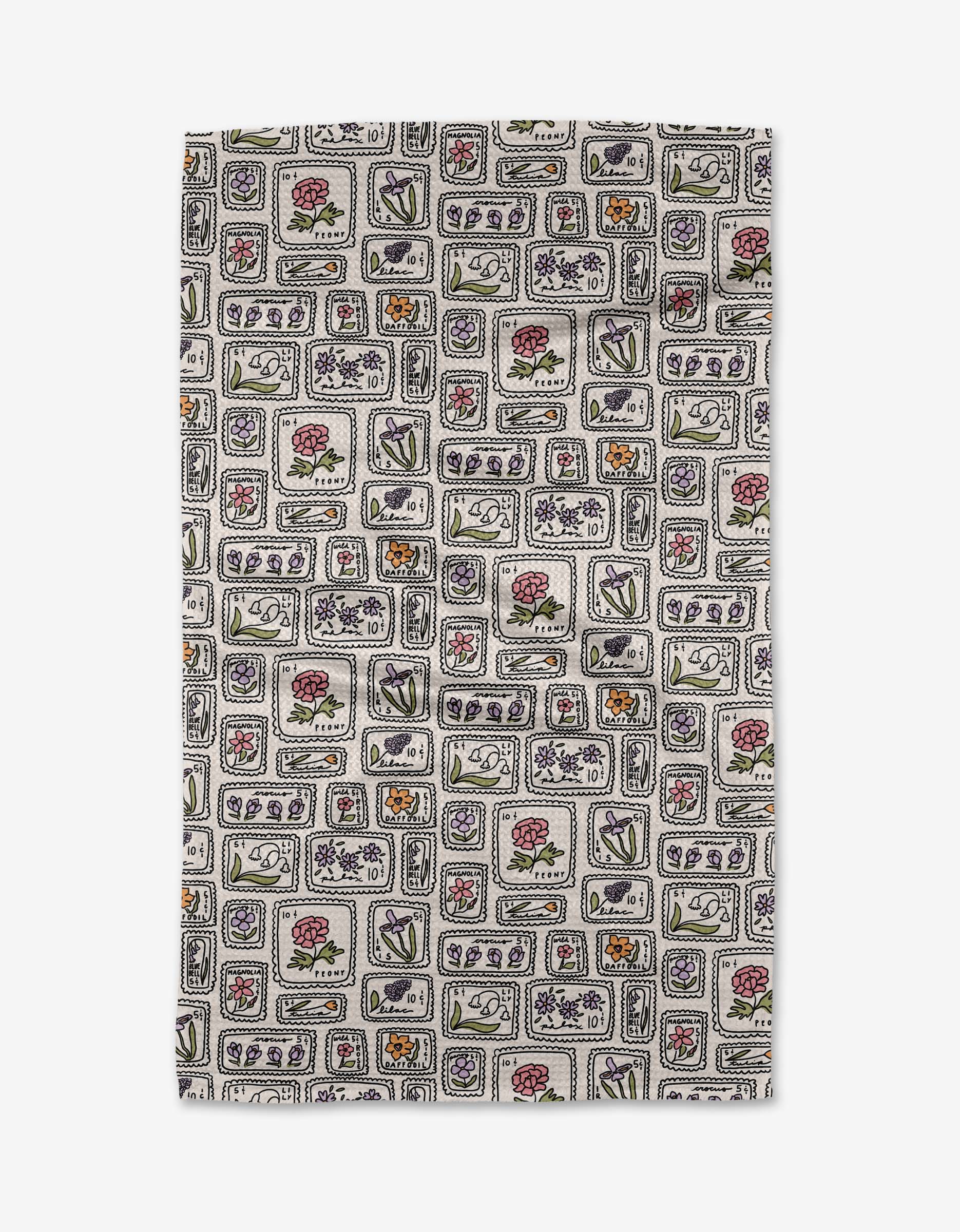 The Kayla Ann “Floral Postage Stamps” tea towel features a light background with red, purple, green, orange, and black floral and geometric squares on absorbent Geoweave fabric.