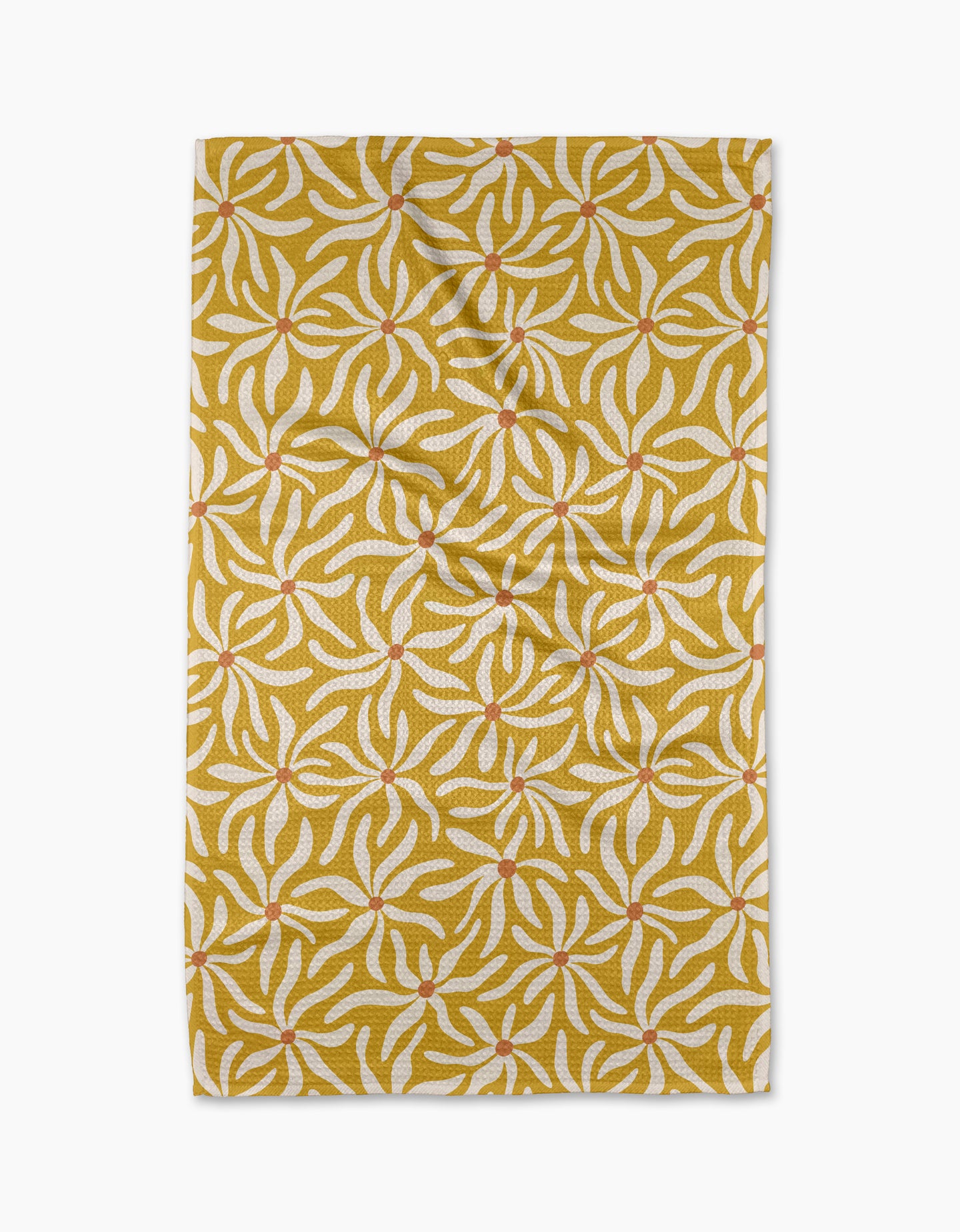 The Floral Spell rug by Gerdadzy is rectangular and yellow, featuring white and orange abstract leaf patterns. Photographed from above on a white background, it has slight creases and resembles a quick-drying tea towel.