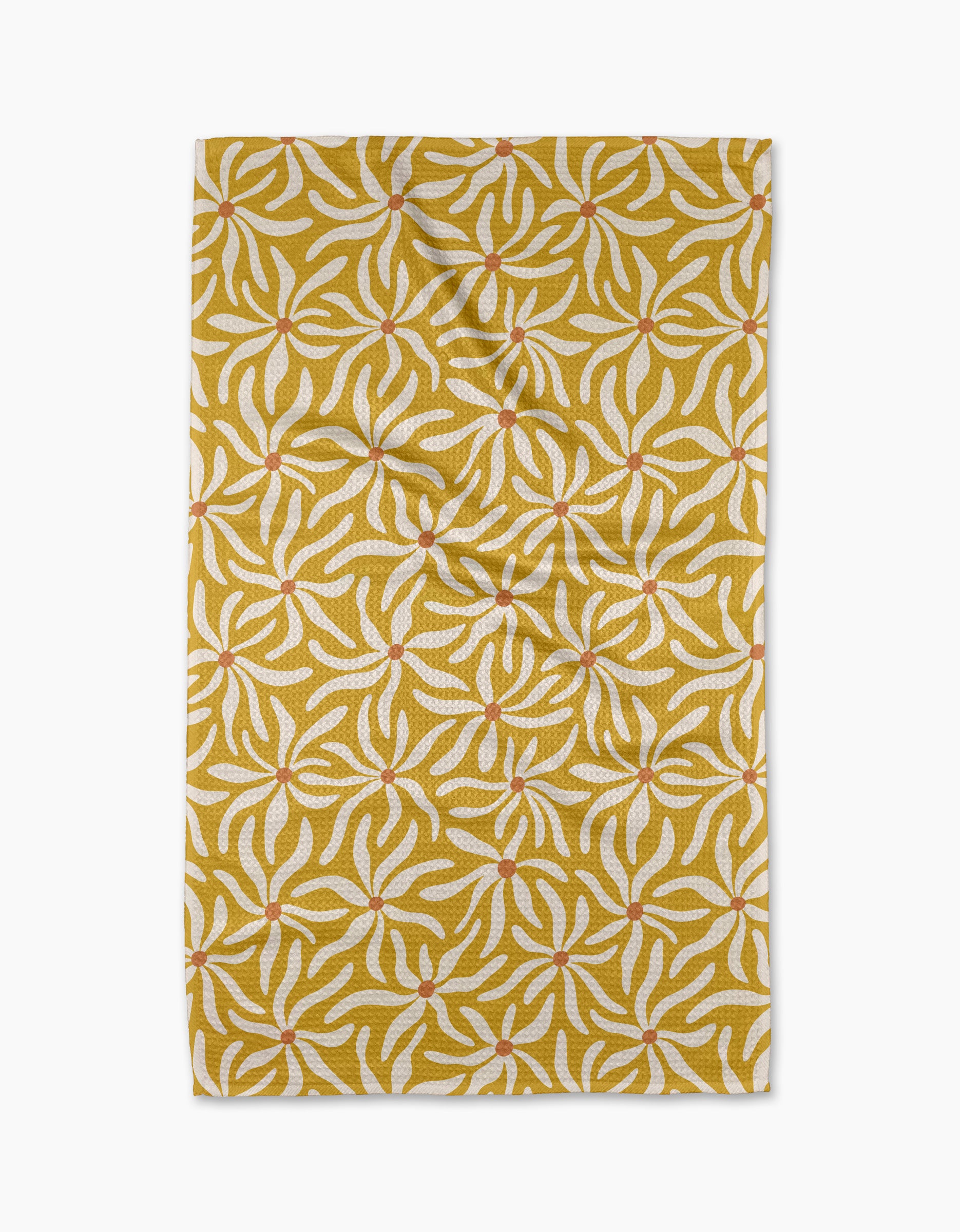The Floral Spell rug by Gerdadzy is rectangular and yellow, featuring white and orange abstract leaf patterns. Photographed from above on a white background, it has slight creases and resembles a quick-drying tea towel.