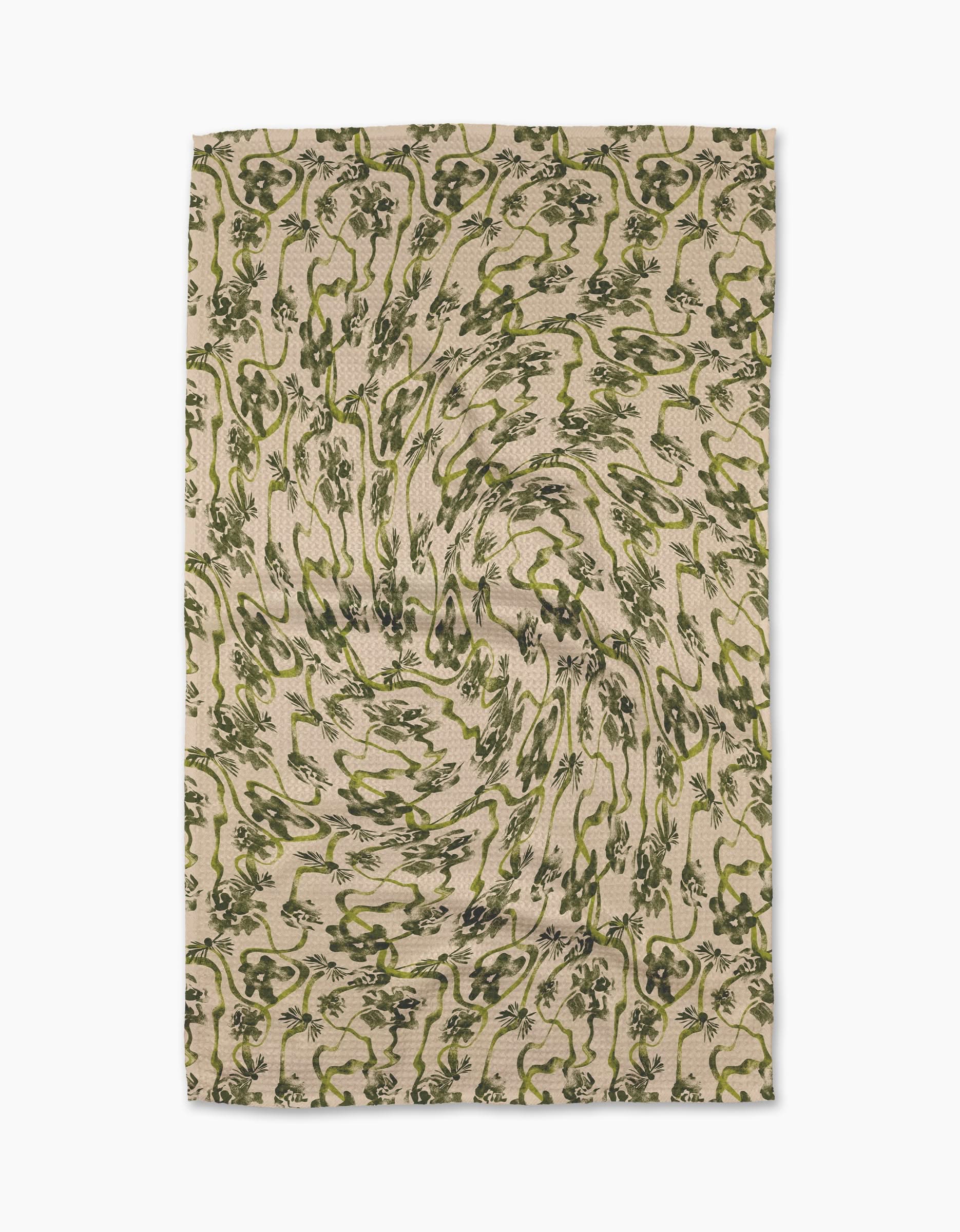 The Geometry Floral Swirls Green tea towel features a green and black abstract floral pattern with vortex-like swirls on soft Geoweave fabric.