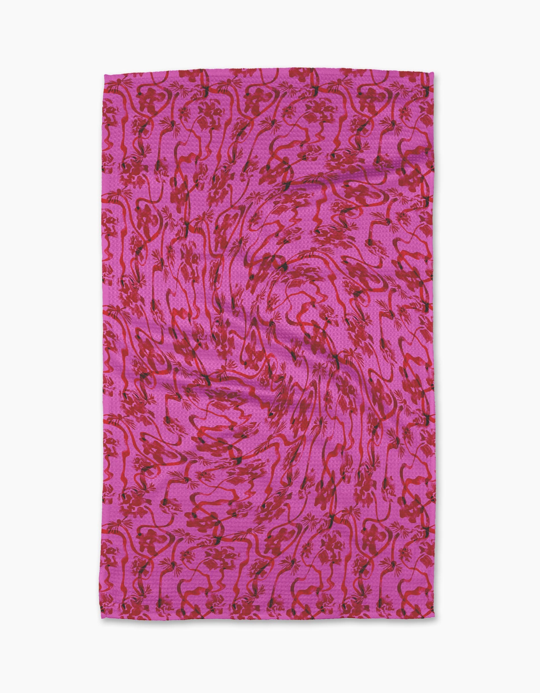 The Geometry Floral Swirls Pink Tea Towel features red swirling abstract patterns on a pink backdrop, crafted from Geoweave™ fabric for enhanced texture. The towel is shown flat against a white background.