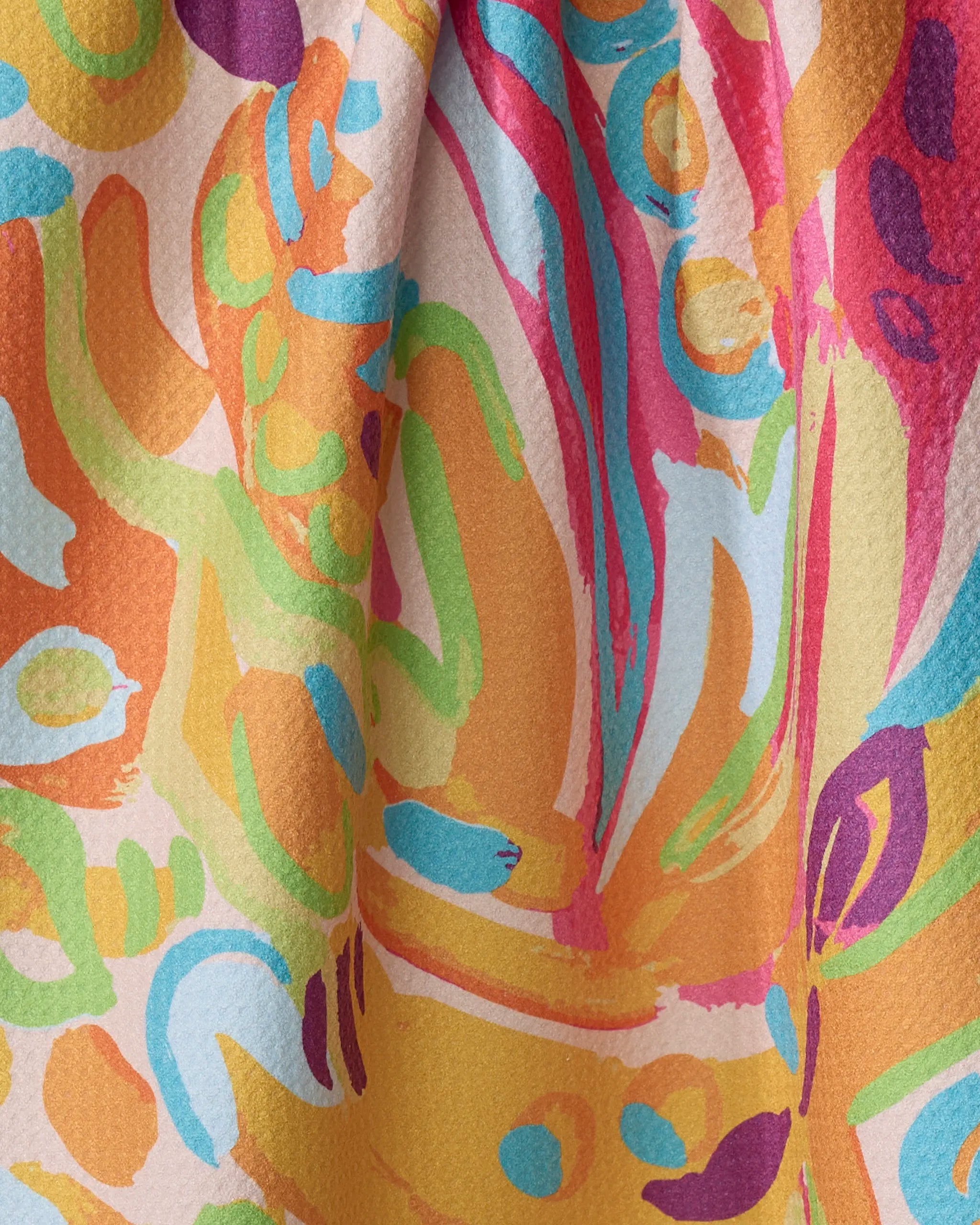 Florescence by Sareka Unique is a colorful abstract fabric made from recycled materials, featuring vibrant orange, teal, red, yellow, green, and blue swirls on a light background—ideal for a stylish tea towel.