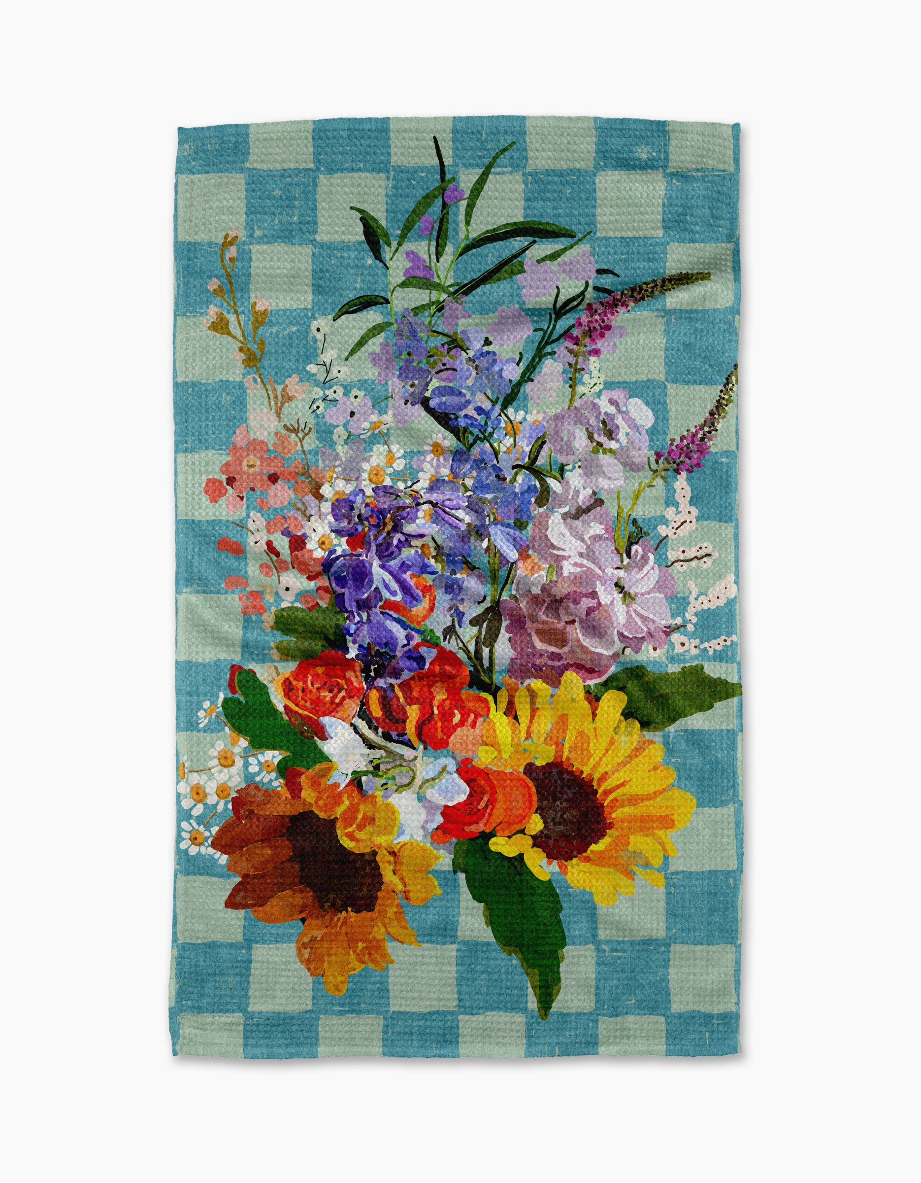Add charm to your home with Pascale Dilger’s Flower Bouquet kitchen towel—a blue and white checkered, recycled towel featuring a central illustration of sunflowers, orange blooms, and purple wildflowers. Eco-friendly style!.