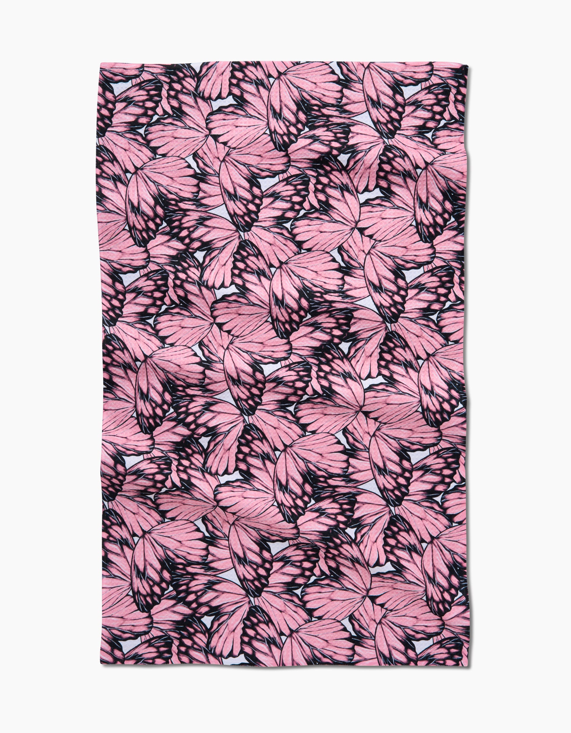 Flutter by Butterfly by Aubrey Fairchild: a rectangular tea towel crafted from recycled materials, featuring overlapping pink butterfly wings with black accents on a white background.