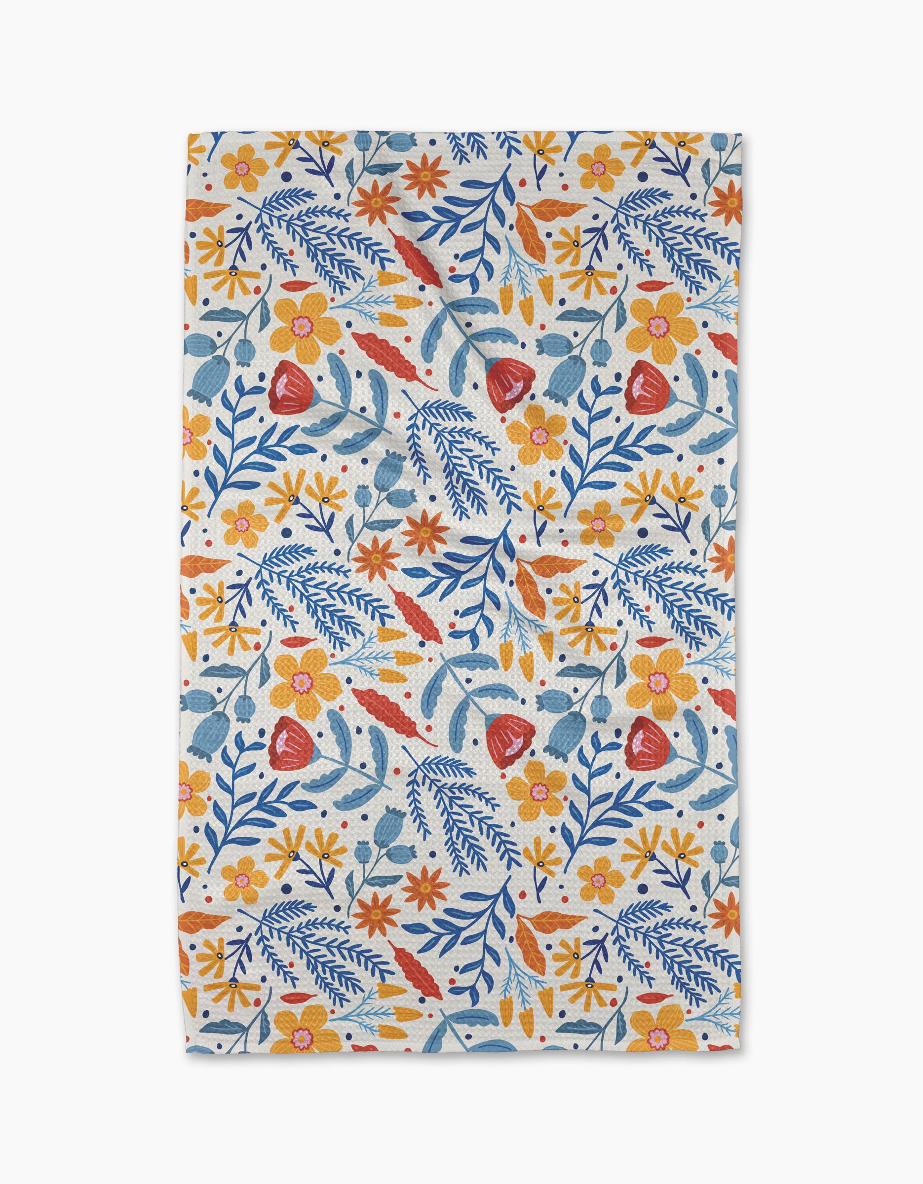 The Folk Flora tea towel by Cottonflower Studio features a colorful floral design—orange, yellow, and red flowers with blue leaves—on white, made from quick-drying recycled materials.