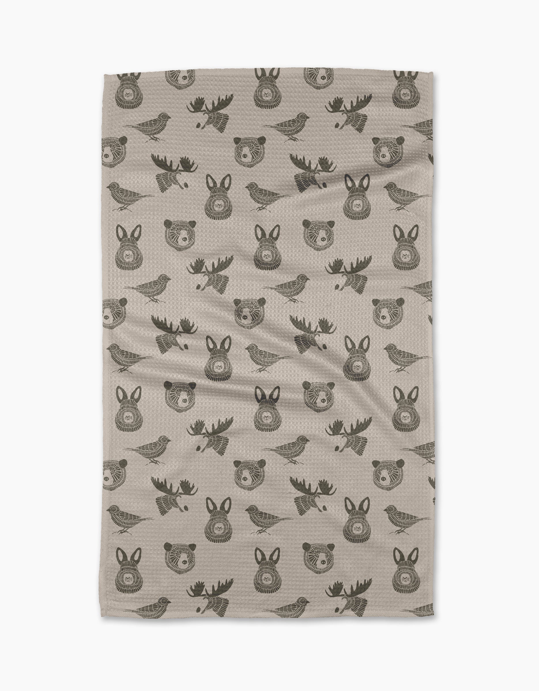 The Forest Animals tea towel by Rosa Kichline features beige fabric with a repeating pattern of simple, dark brown cartoon-style bears, moose, rabbits, and birds. Quick-drying and practical, it brings charm to any kitchen.