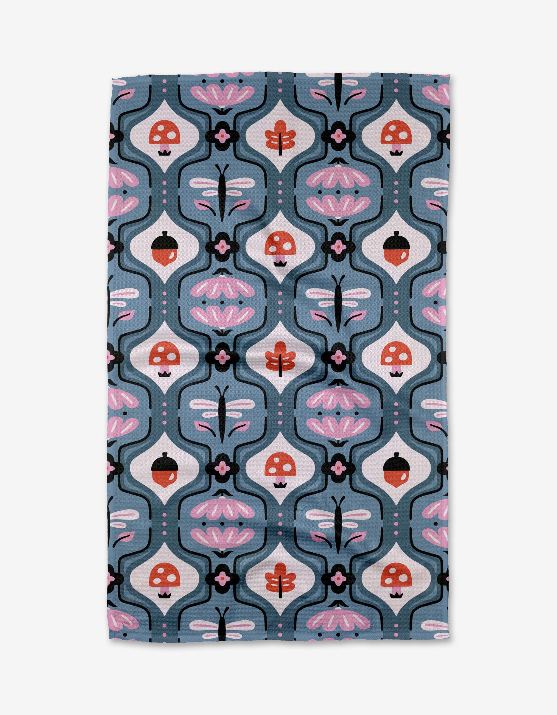 The Forest Garden towel by Anette Heiberg is ultra-absorbent and showcases whimsical mushrooms, dragonflies, and abstract florals in pink, red, black, and white on a blue background.