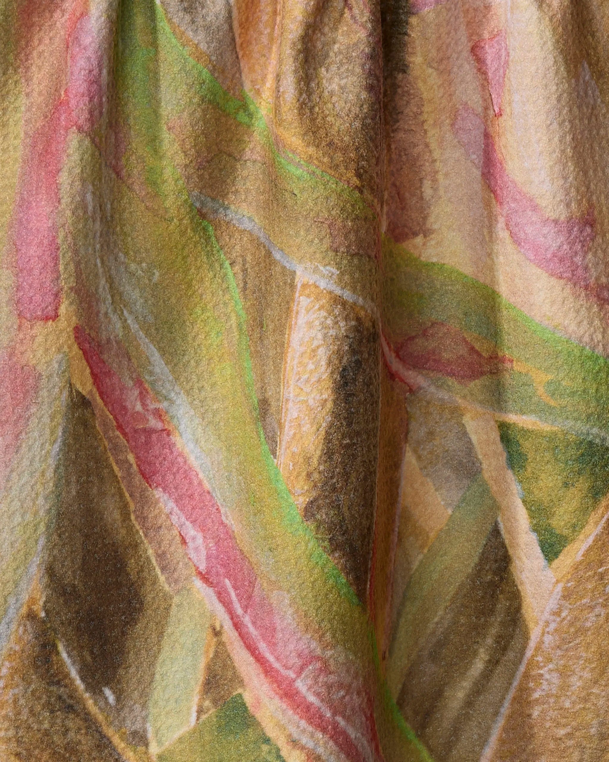 Close-up of the Forest of Trees tea towel by Taryn Brennan, made from recycled materials with textured fabric and abstract, watercolor-inspired earthy tones—soft greens, pinks, yellows, and browns blending together.