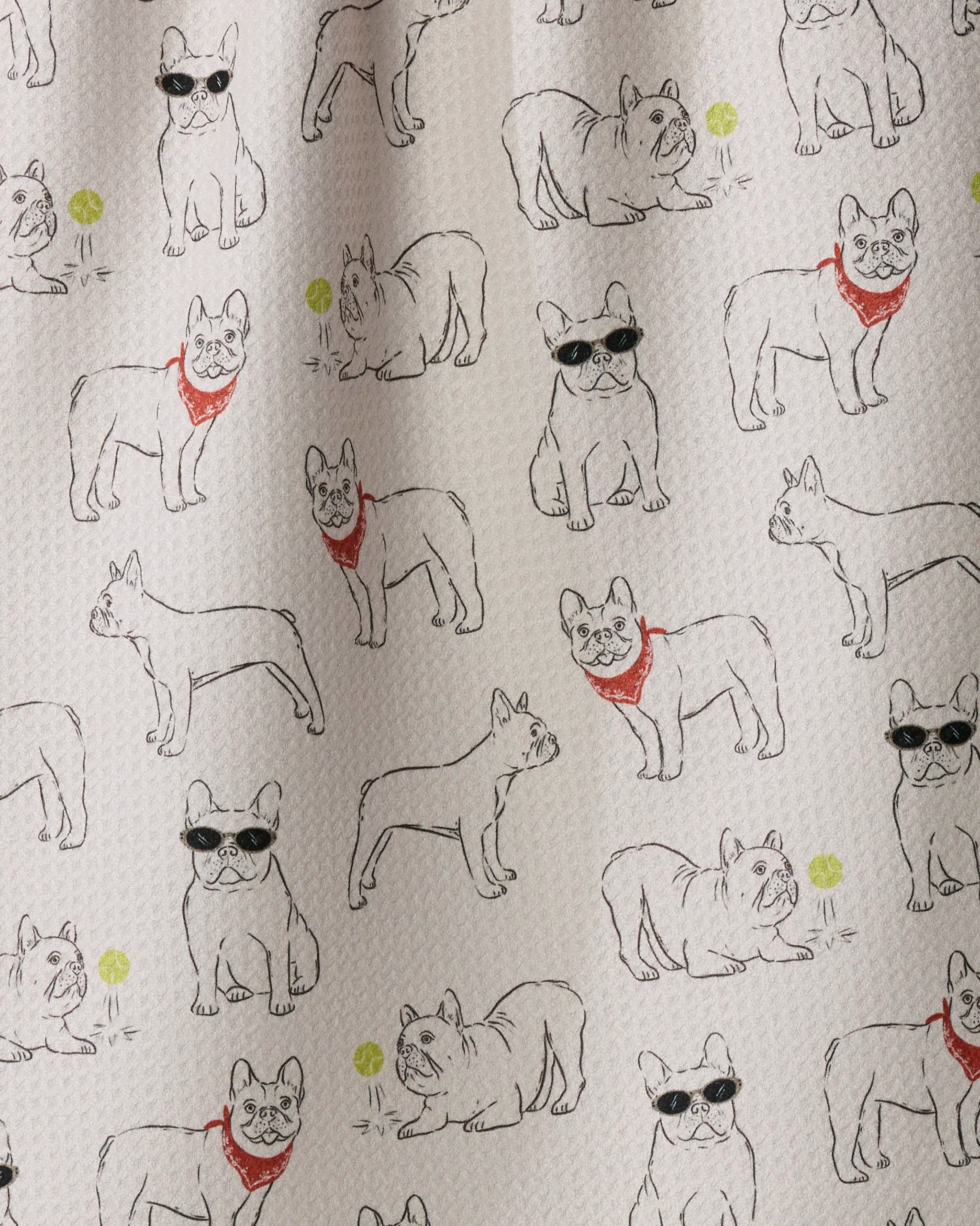 Add playful charm to your kitchen with Geometry’s Frenchie Frolic tea towel, featuring a textured white background patterned with outlined French bulldogs—some sporting sunglasses or red bandanas—alongside scattered green circles, and crafted from recycled materials.