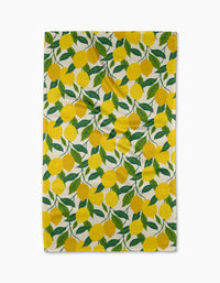 The Fresh Start tea towel by Susan Heid is rectangular, ultra-absorbent, and features a repeating design of bright yellow lemons with green leaves on a white background.
