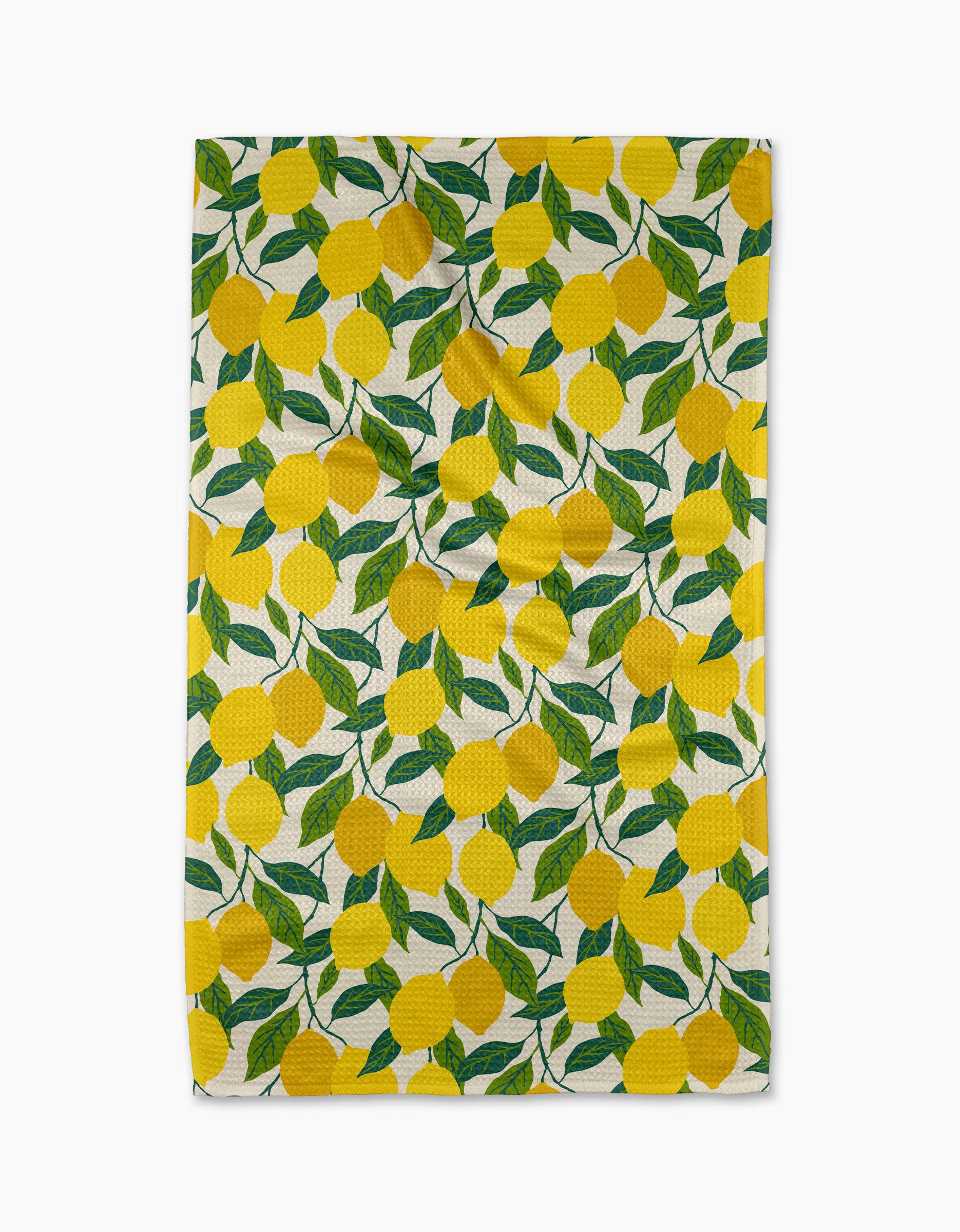 The Fresh Start tea towel by Susan Heid is rectangular, ultra-absorbent, and features a repeating design of bright yellow lemons with green leaves on a white background.